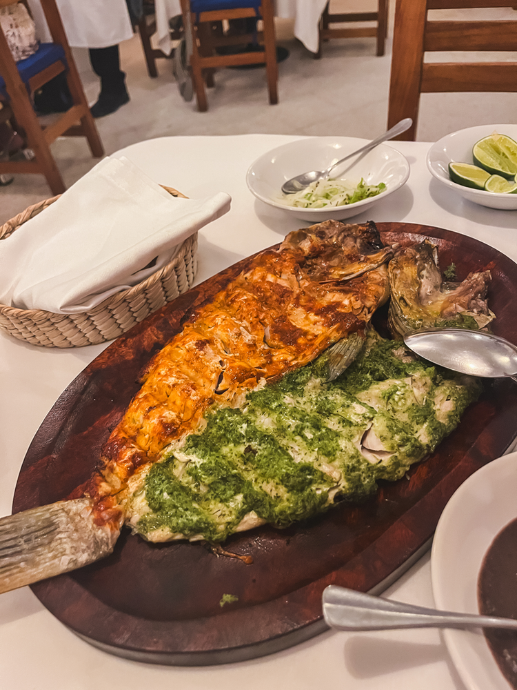 Whole red and green fish at Entremar