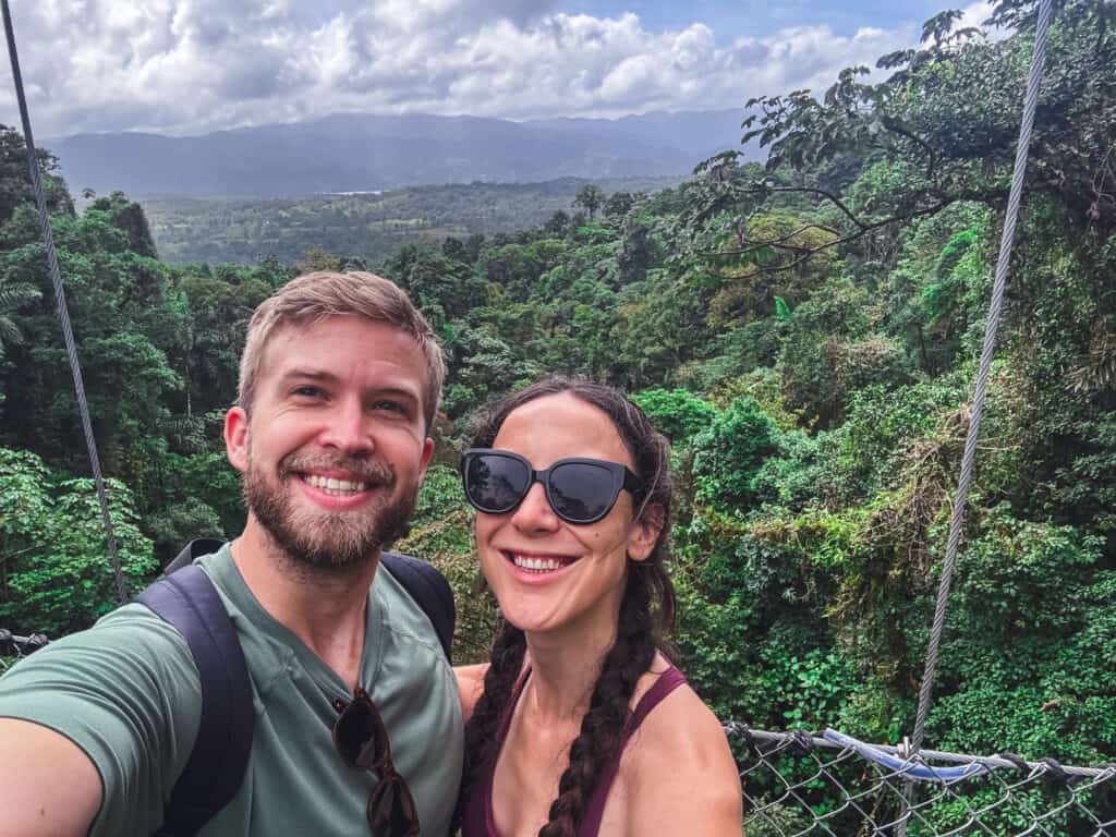 couple with rainforest view at the mistico arenal hanging bridges park