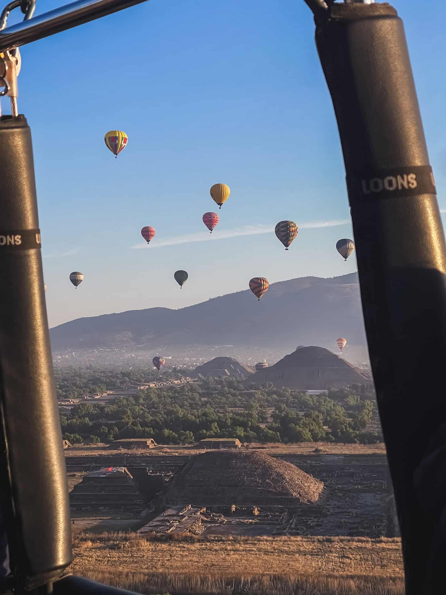 Teotihuacán pyramids seen from a hot air balloon tour at dawn