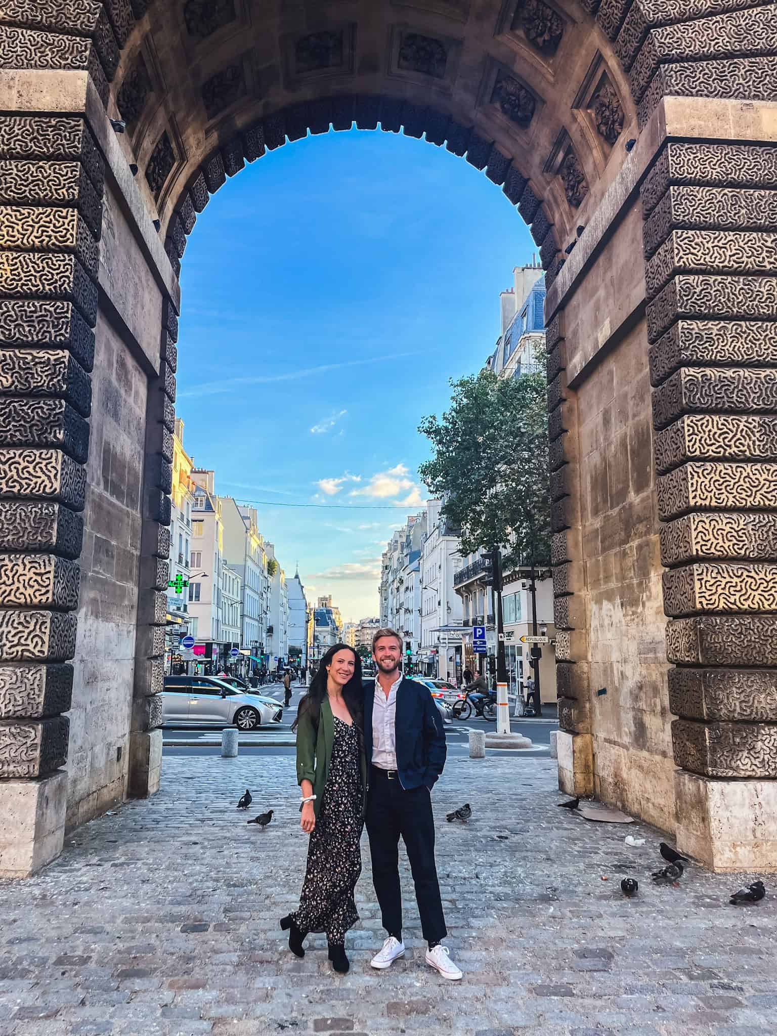 couple Stroll under historic arches and explore classic Parisian streets during your one day in Paris adventure.