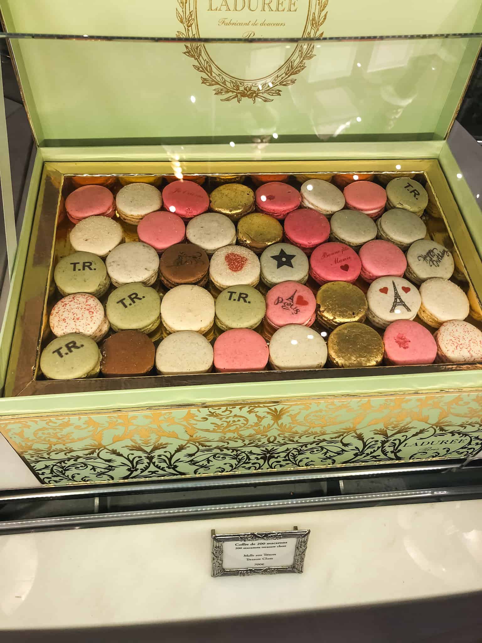 Decorative Ladurée macaron box with assorted colorful macarons, perfect for a sweet treat during 3 days in Paris.