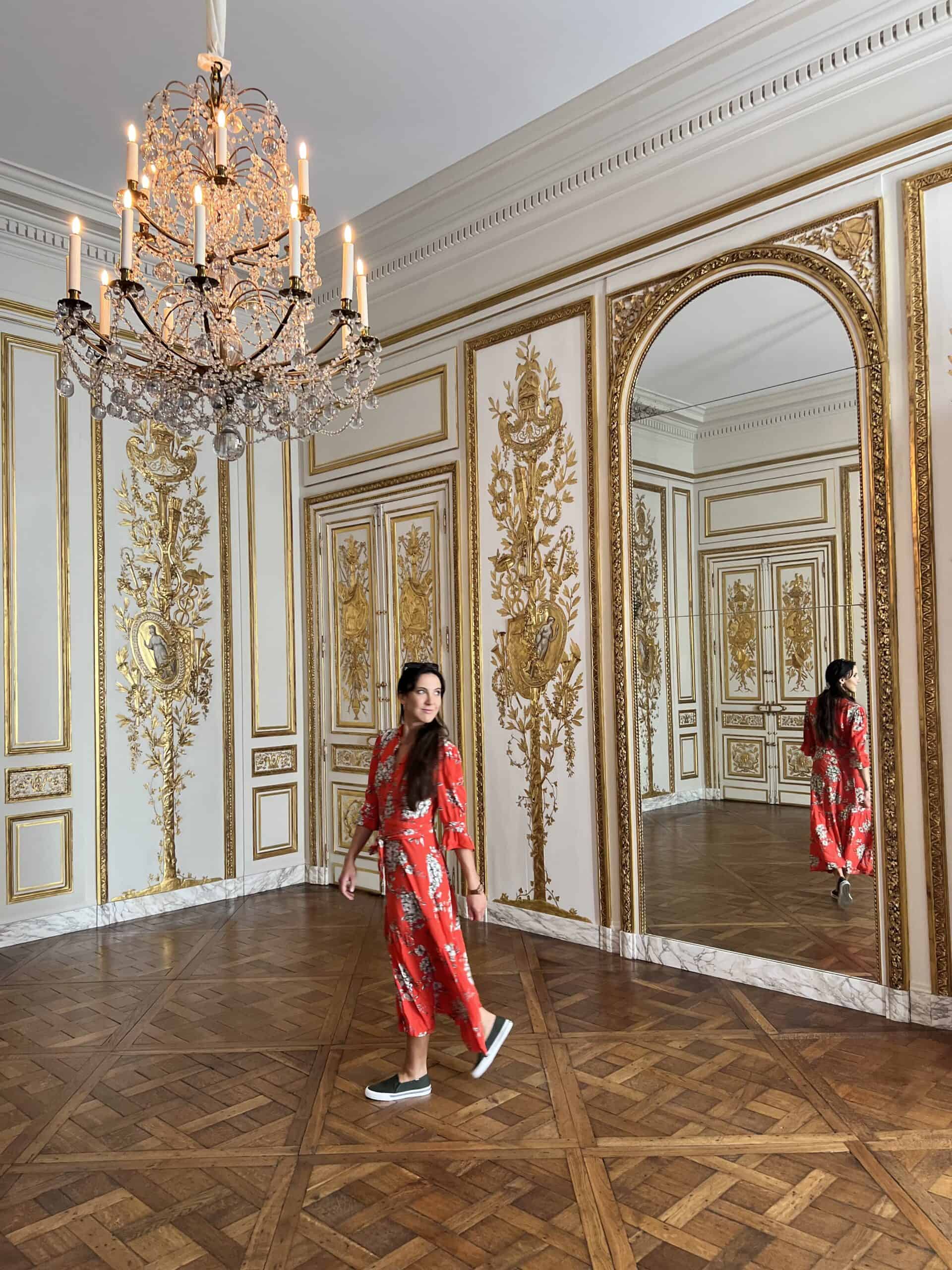 woman in red dress in museum in Paris