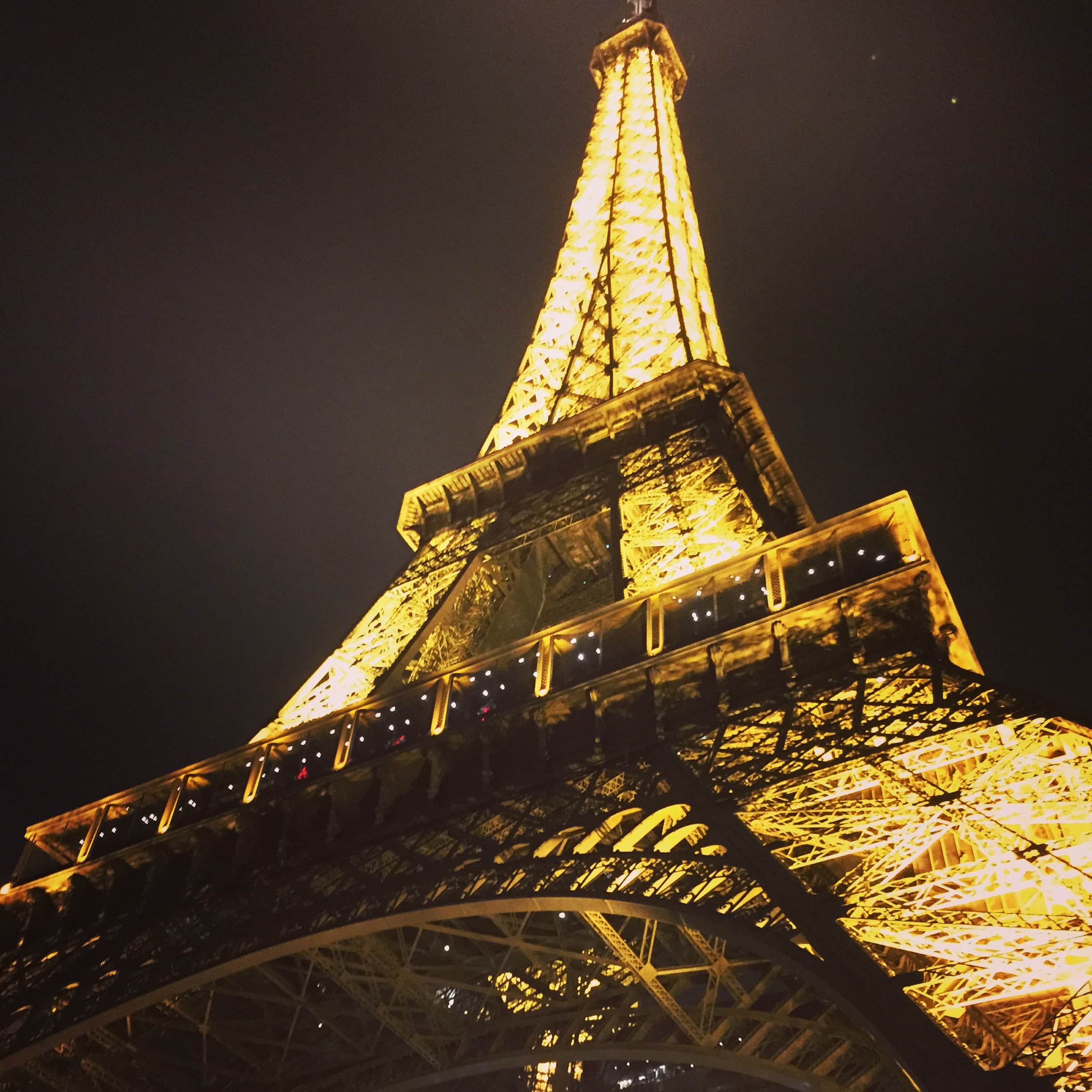 eiffel tower lit up at night