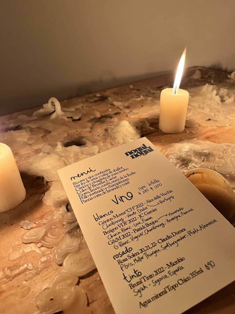 Candlelit table and tasting menu at a fine dining restaurant in Mexico City Nogal Nogal