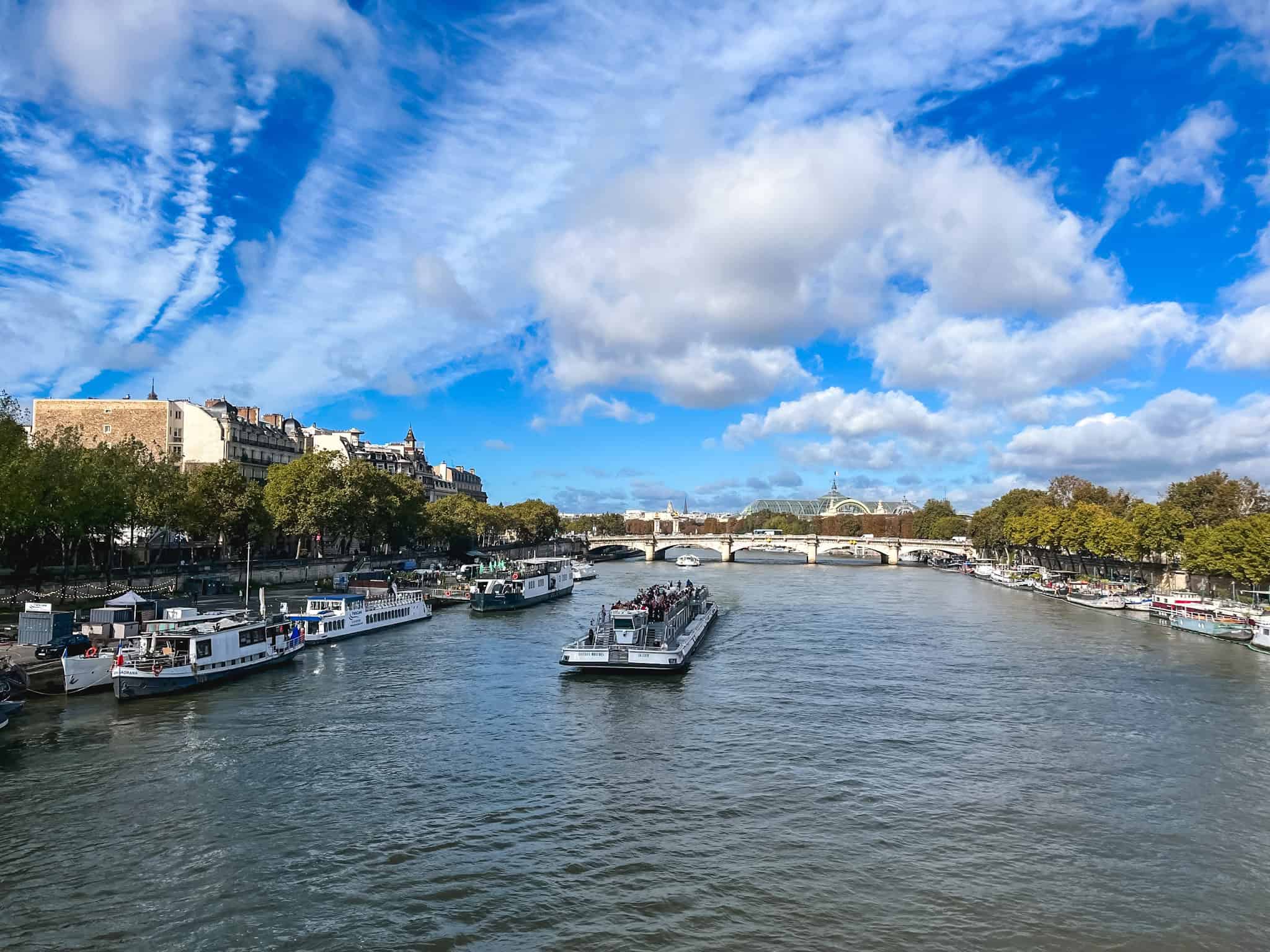 boats on the river seine in paris in the fall