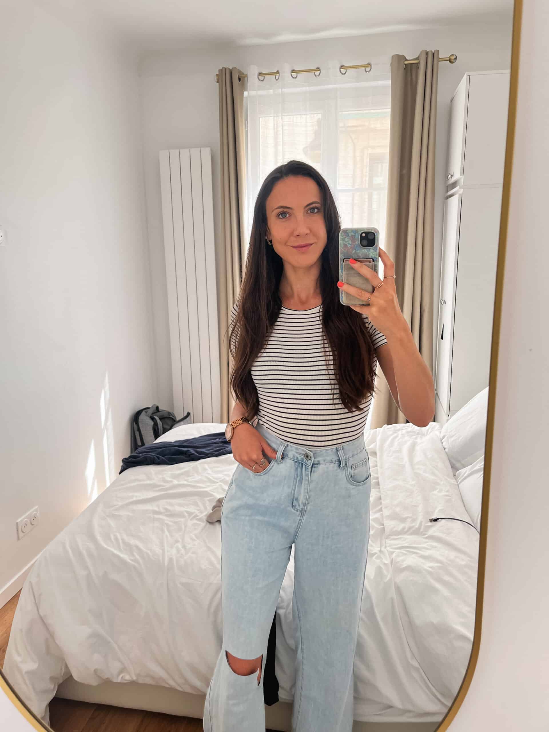 woman in jeans and white and black striped top for paris fall weather
