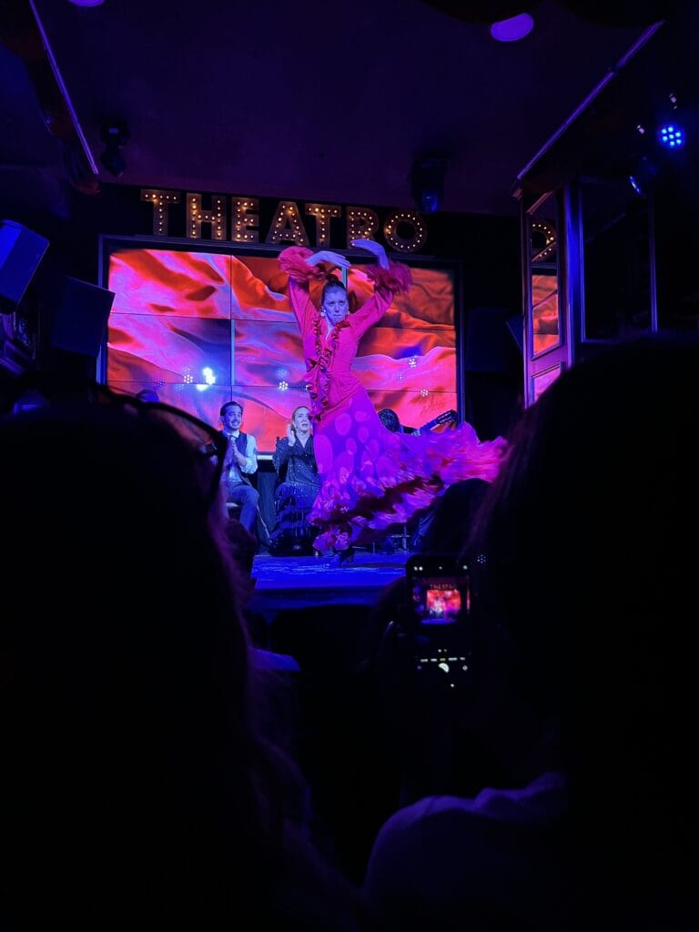 flamenco dancer on red stage on night one of three days in malaga