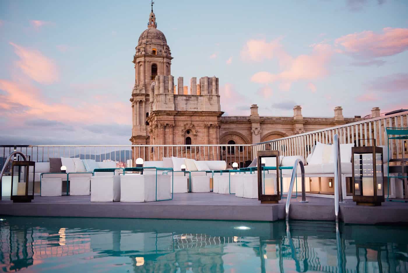 view of malaga cathedral from rooftop pool of the Molina hotel