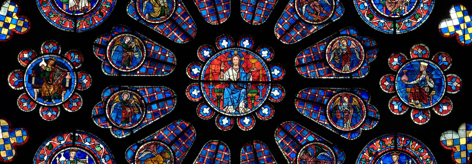Stunning stained glass windows at Chartres Cathedral, a highlight of day trips from Paris by train