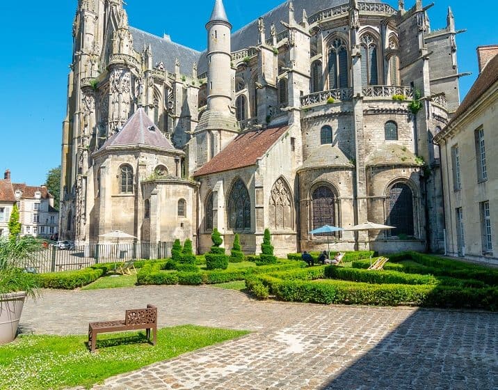 Gothic exterior of Senlis Cathedral with flying buttresses and intricate stonework