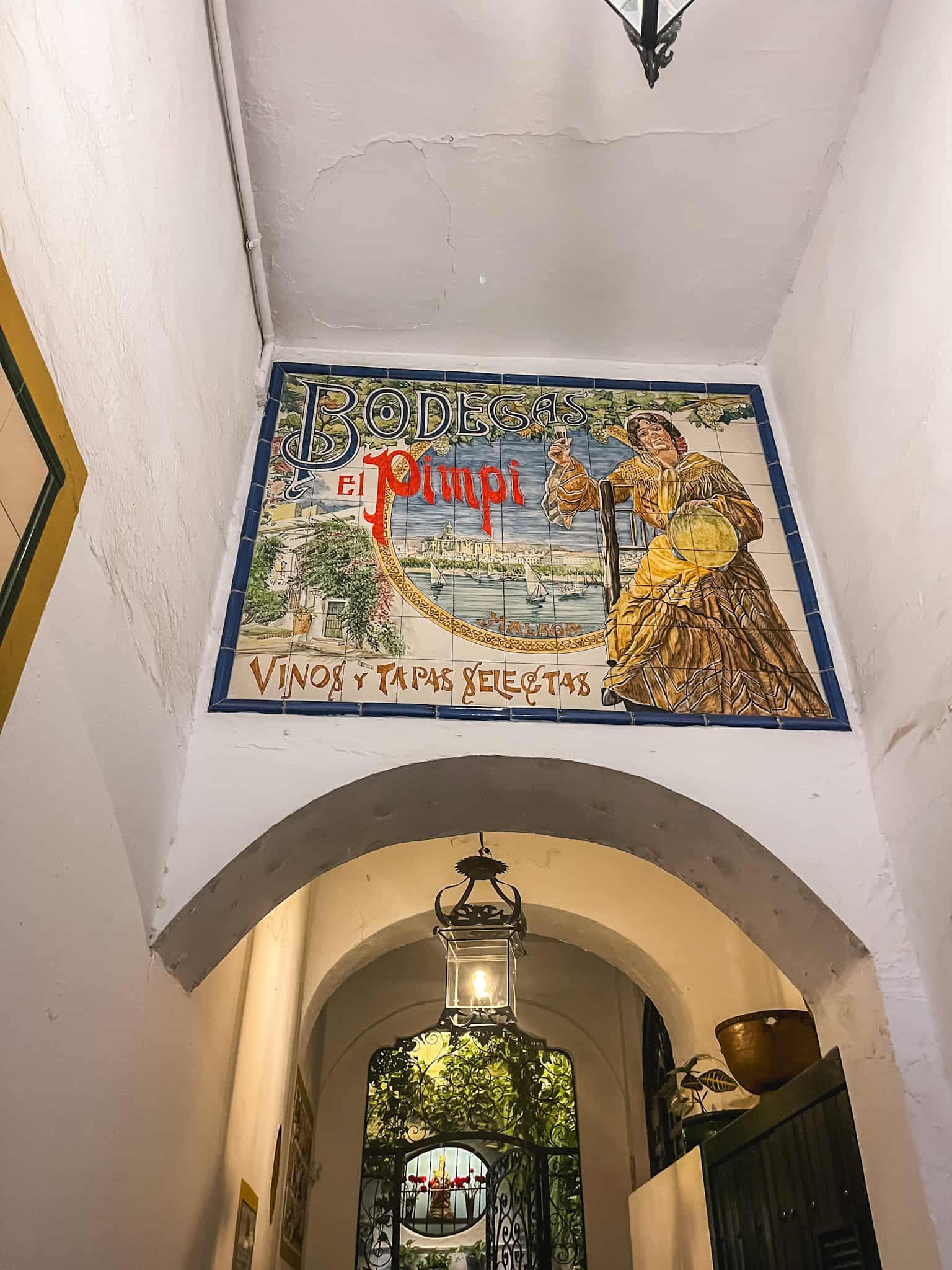 El Pimpi restaurant entrance with traditional tiles, iconic things to do in malaga