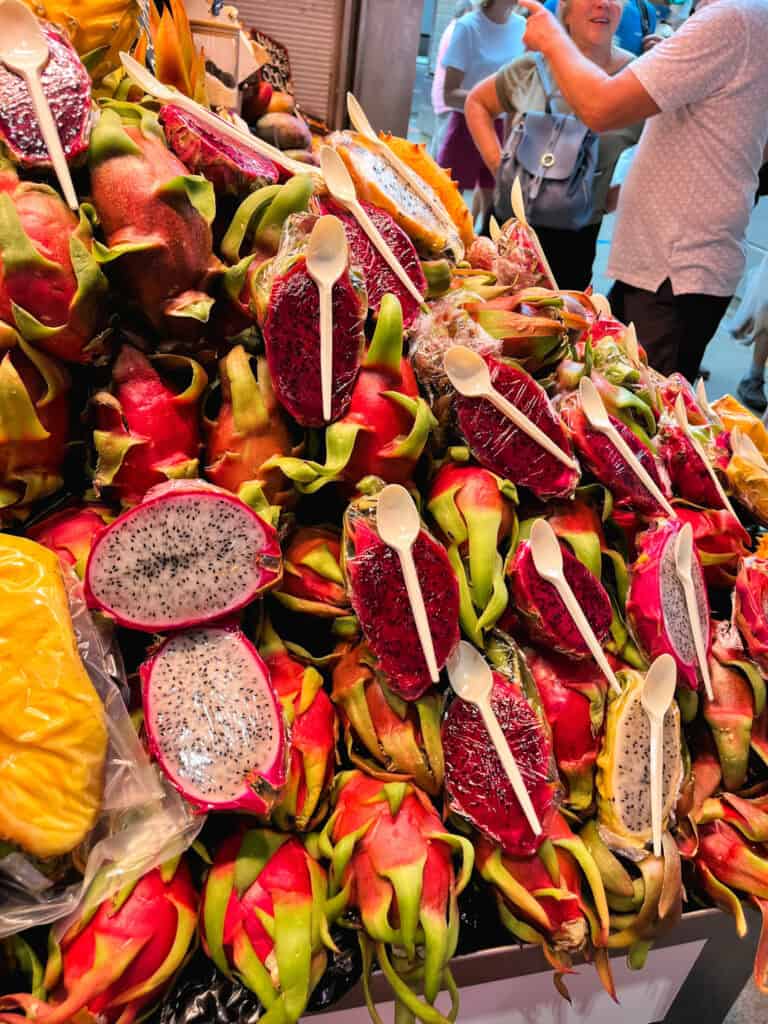 Colorful dragon fruit display at local market, authentic what to do in malaga