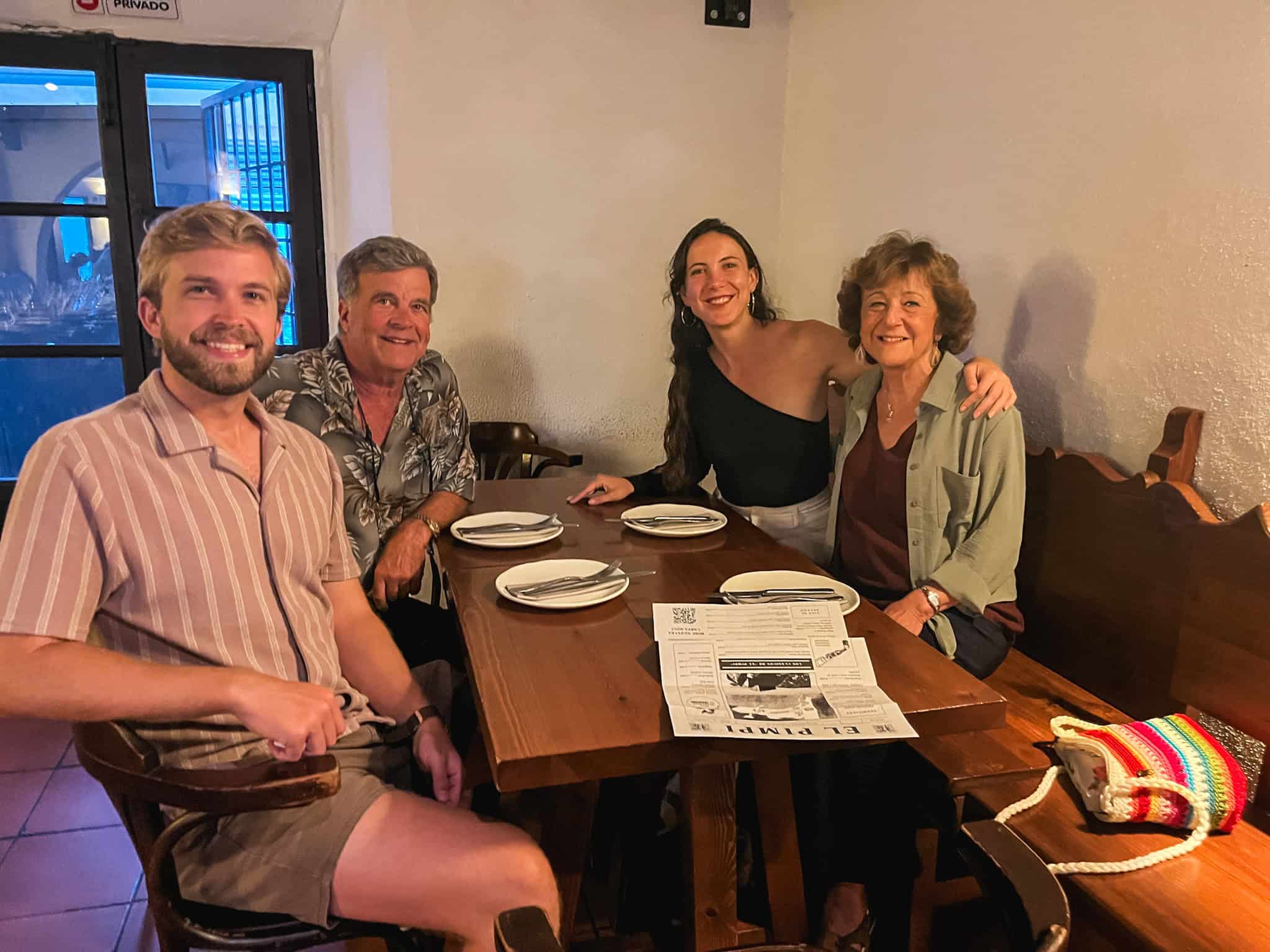 Family enjoying dinner together at El Pimpi showing what to do in malaga for families