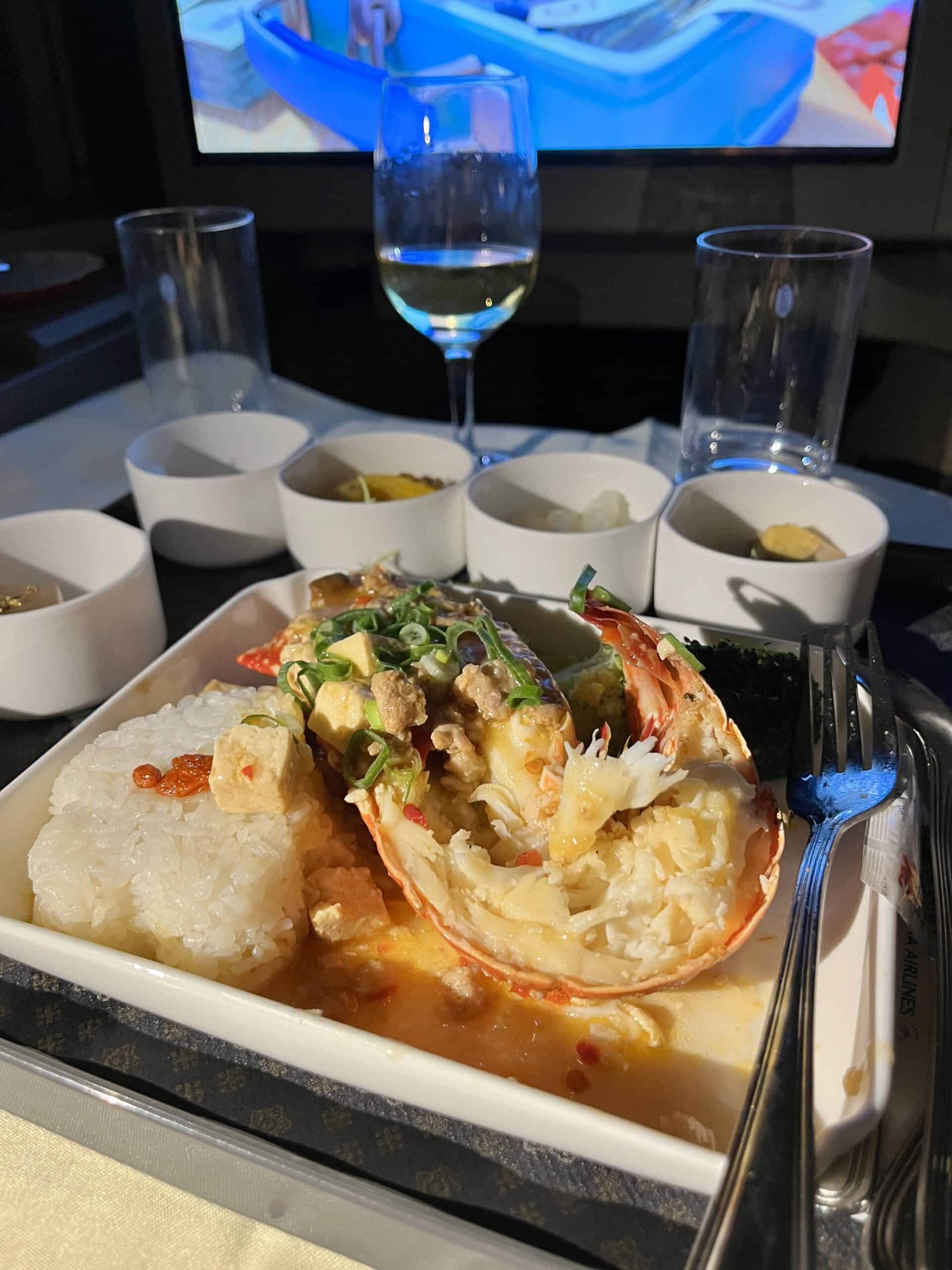 China Airlines business class lobster main course with rice and premium presentation in ceramic bowls