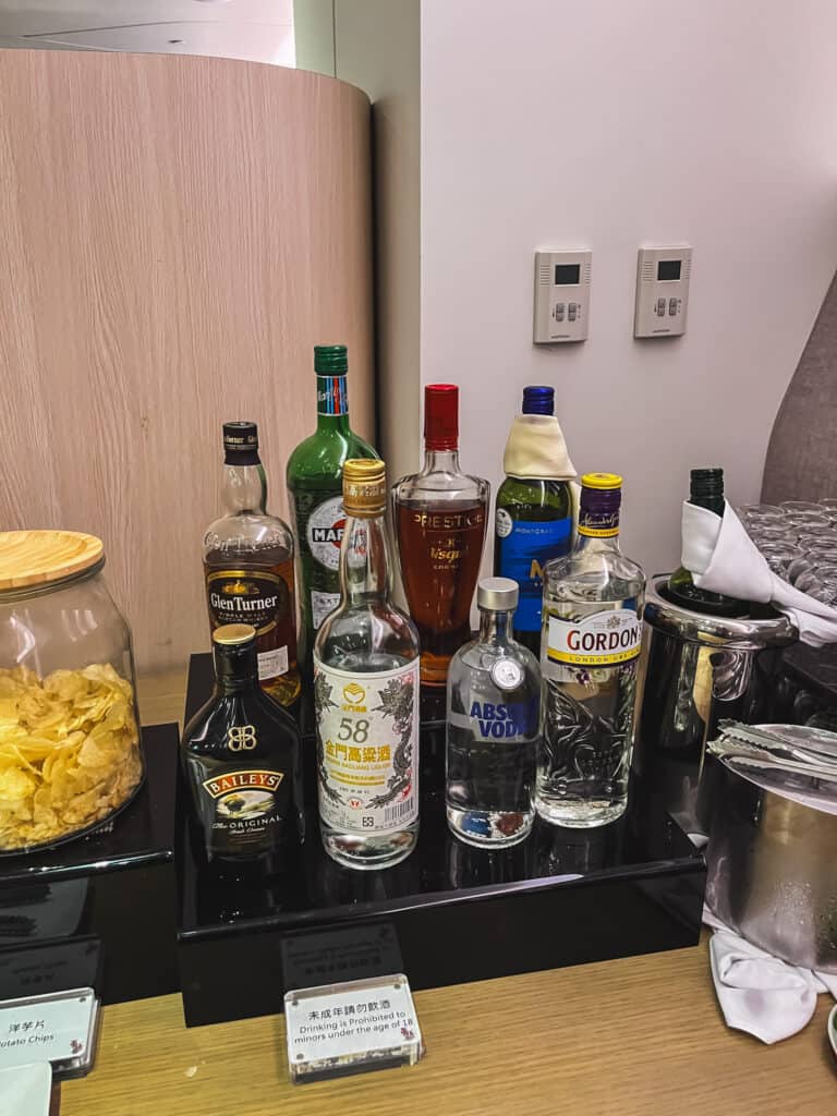 Premium spirits selection at taipei airport lounge bar including whisky, vodka and liqueurs
