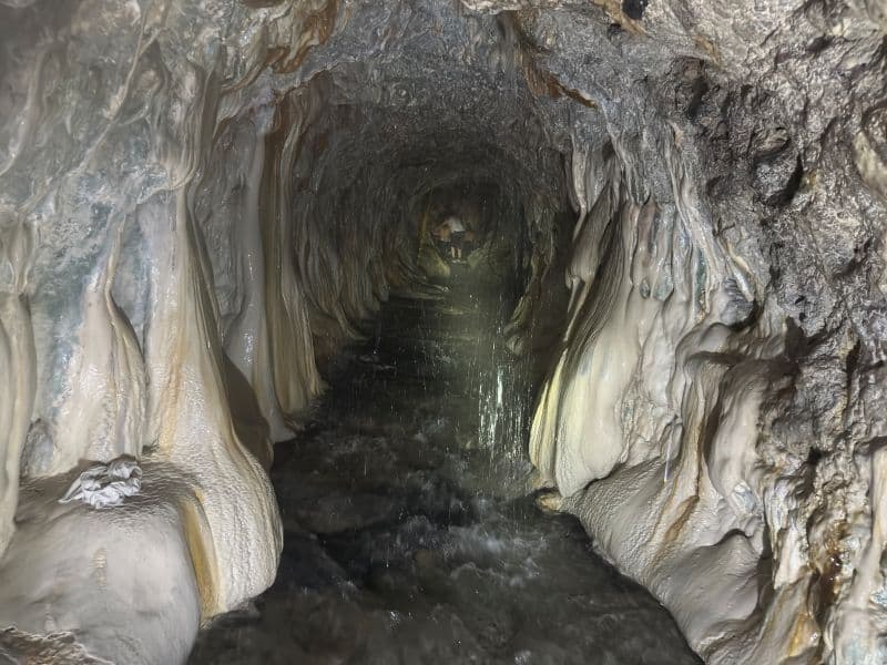 tunnel cave with flowing water