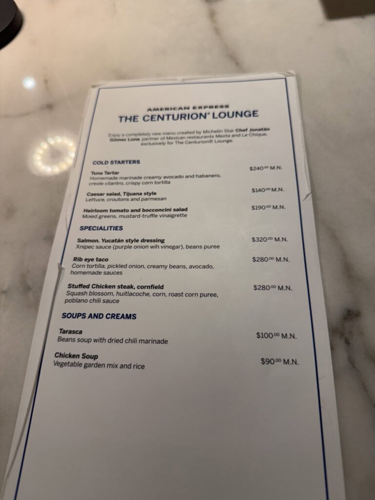 Menu from Amex Centurion lounge showing Classic and Comforting section with items like Margarita Pizza ($170 MXN), Cold cuts pizza ($219 MXN), and Beef Burger ($190 MXN)