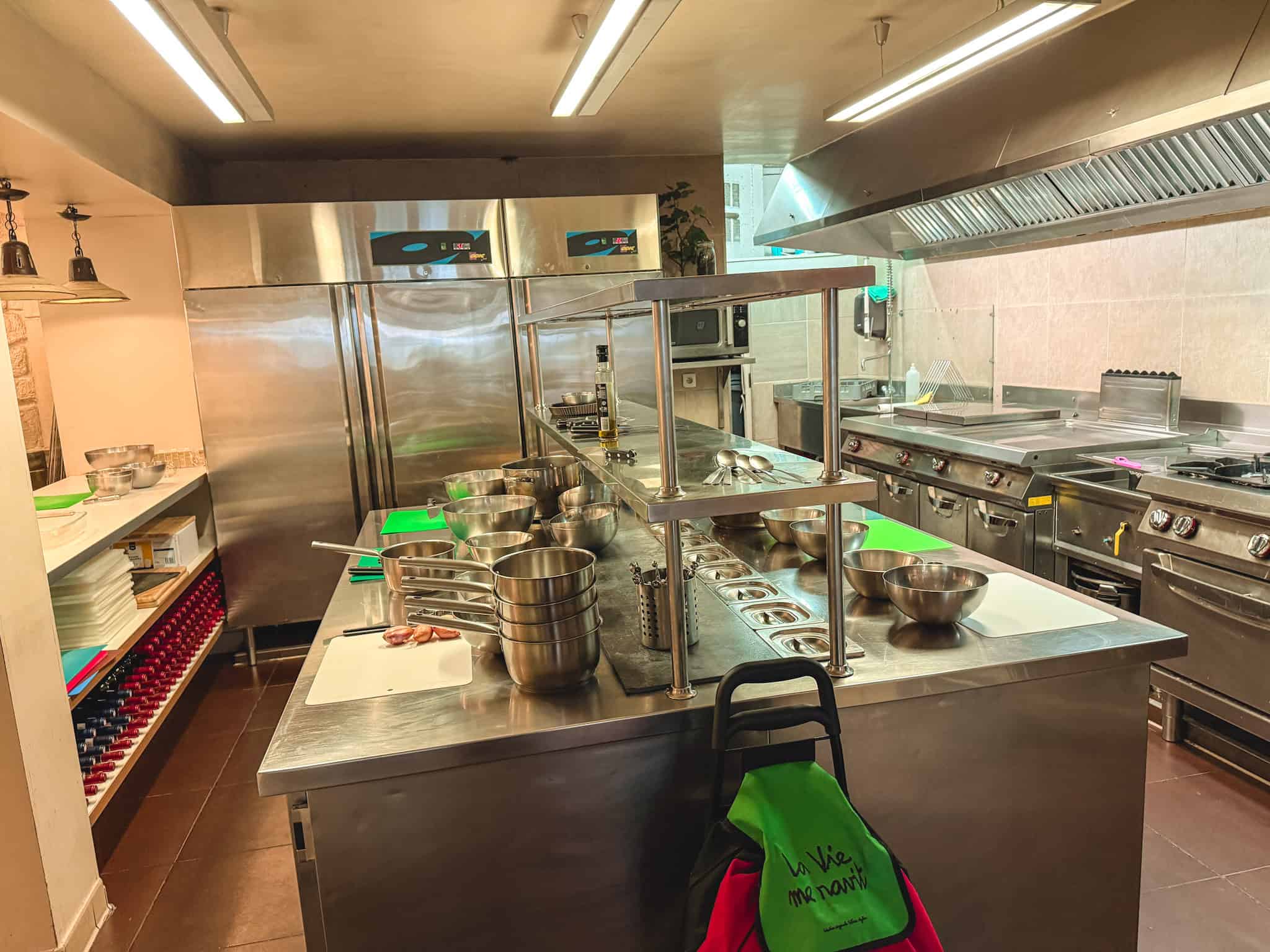 Professional kitchen setup at Paris culinary school with stainless steel workstations and equipment