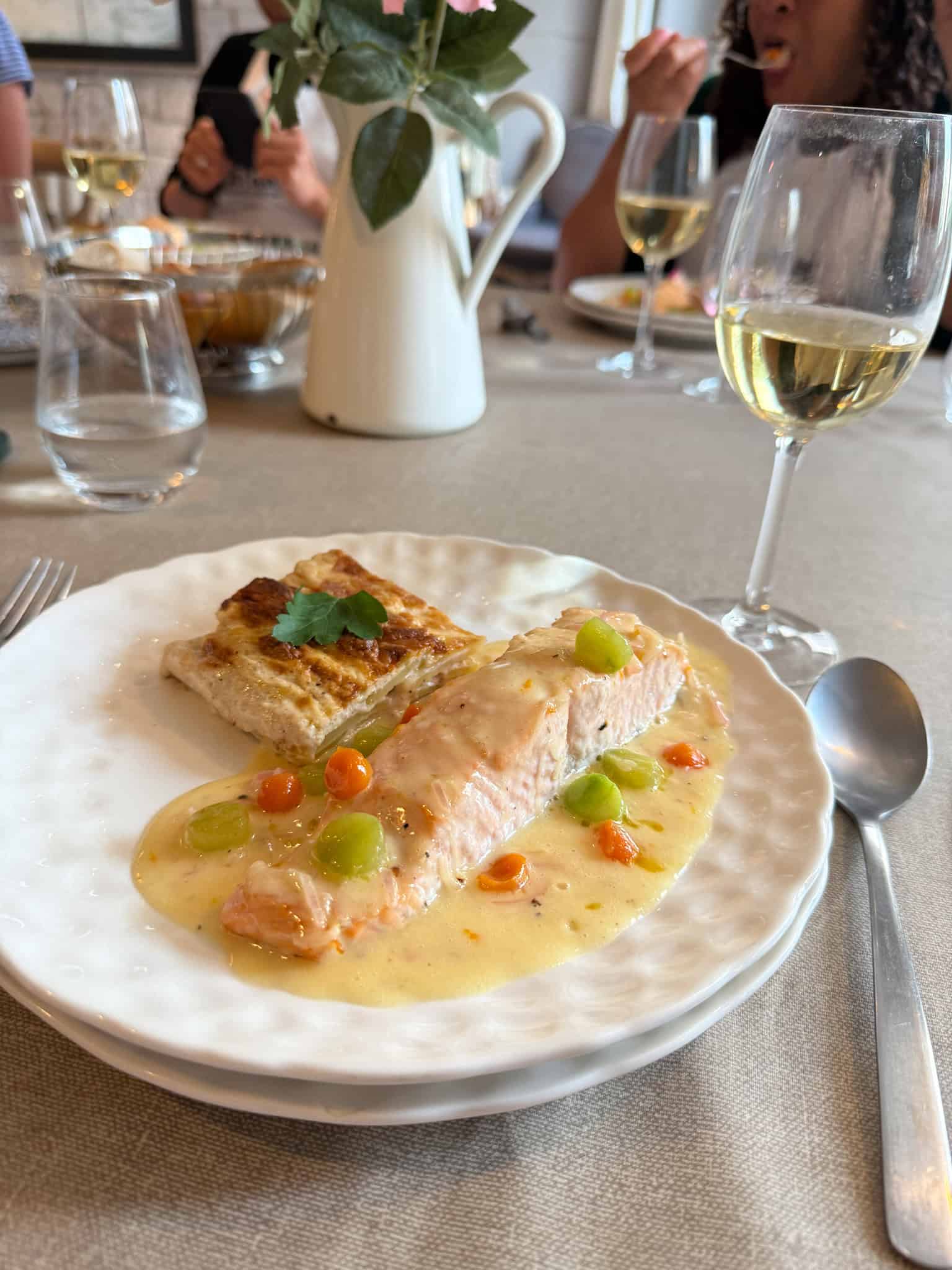Poached salmon with beurre blanc sauce and white wine at French cooking workshop