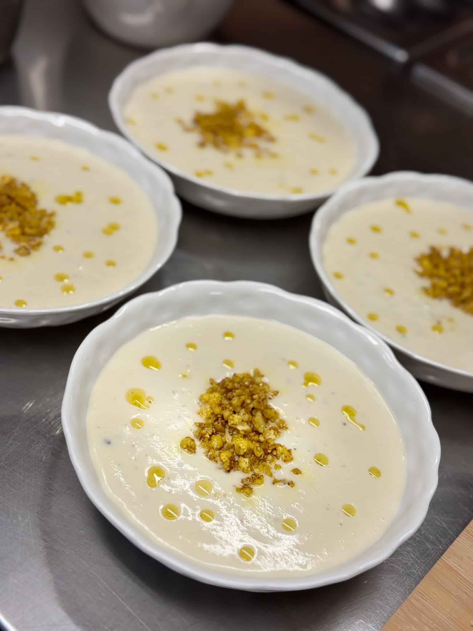Creamy soup prepared during cooking class in Paris topped with truffle oil