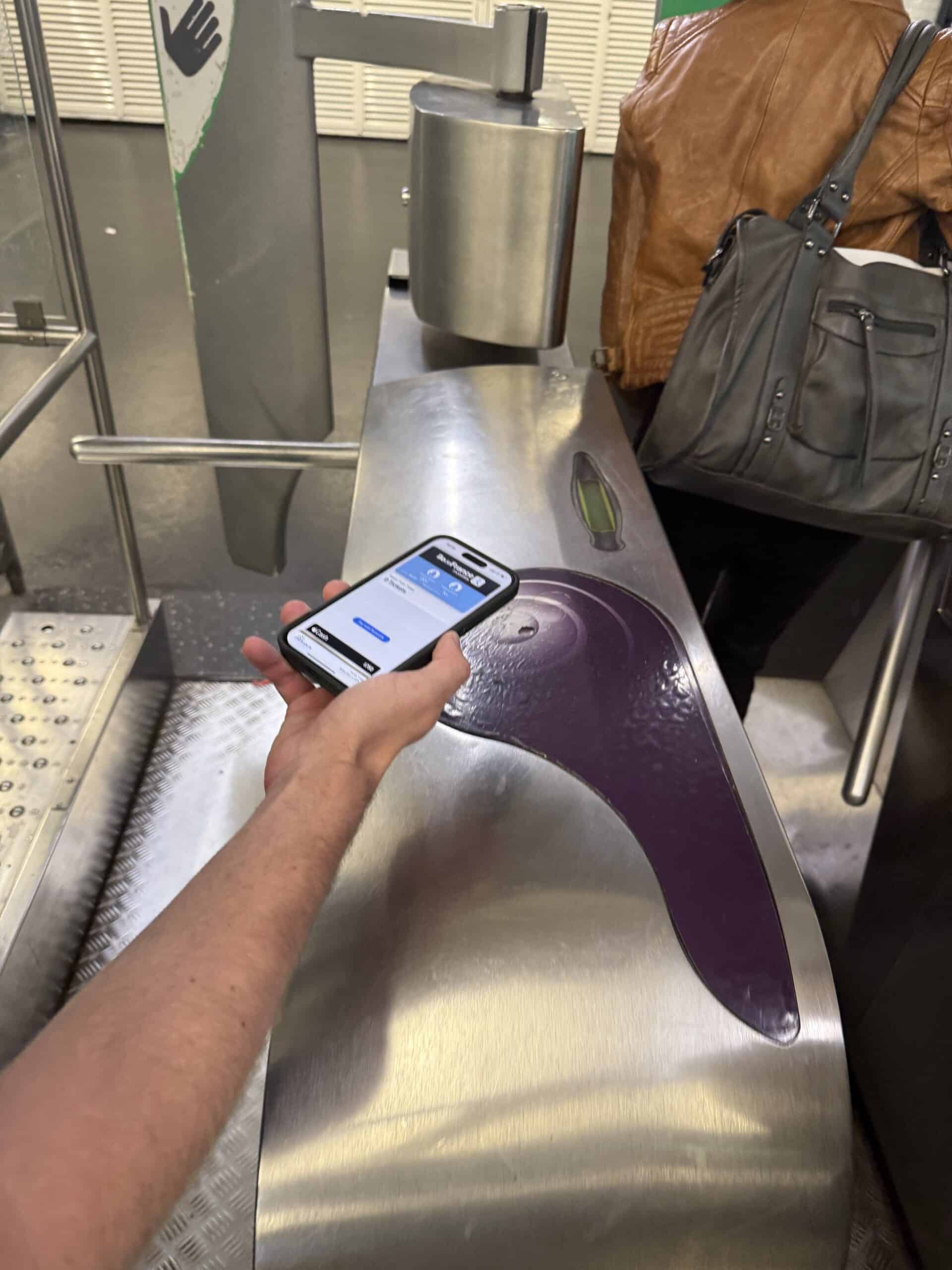 hover phone over paris metro ticket turnstyle