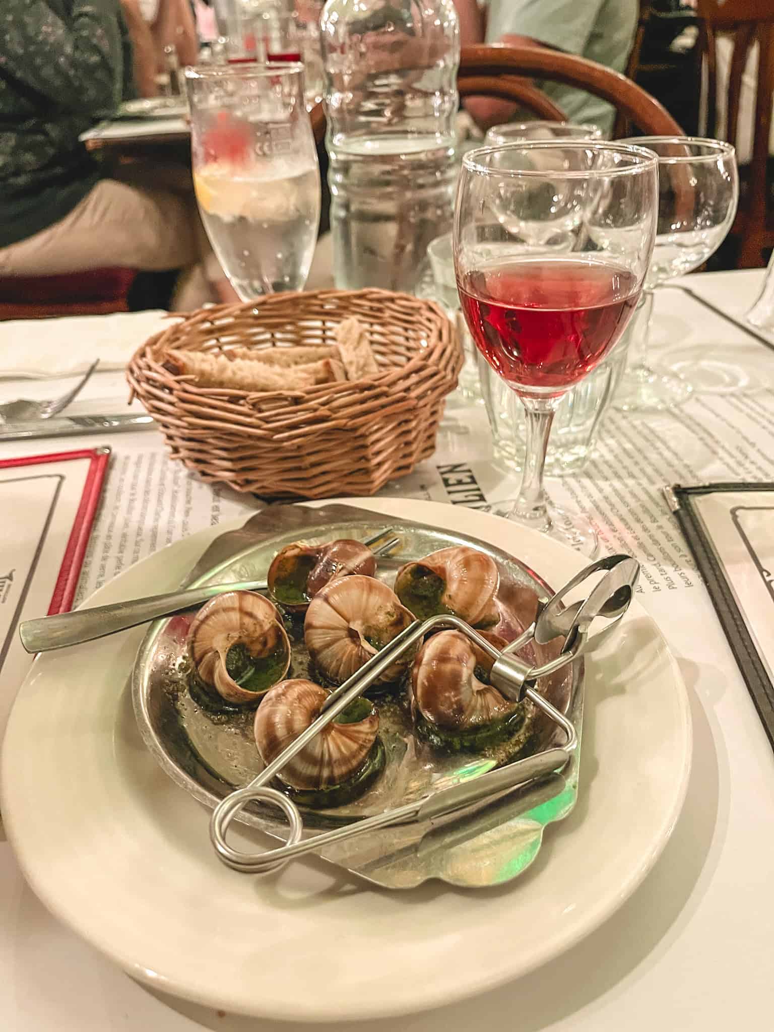 dinner of snails, one of the best things to do in paris