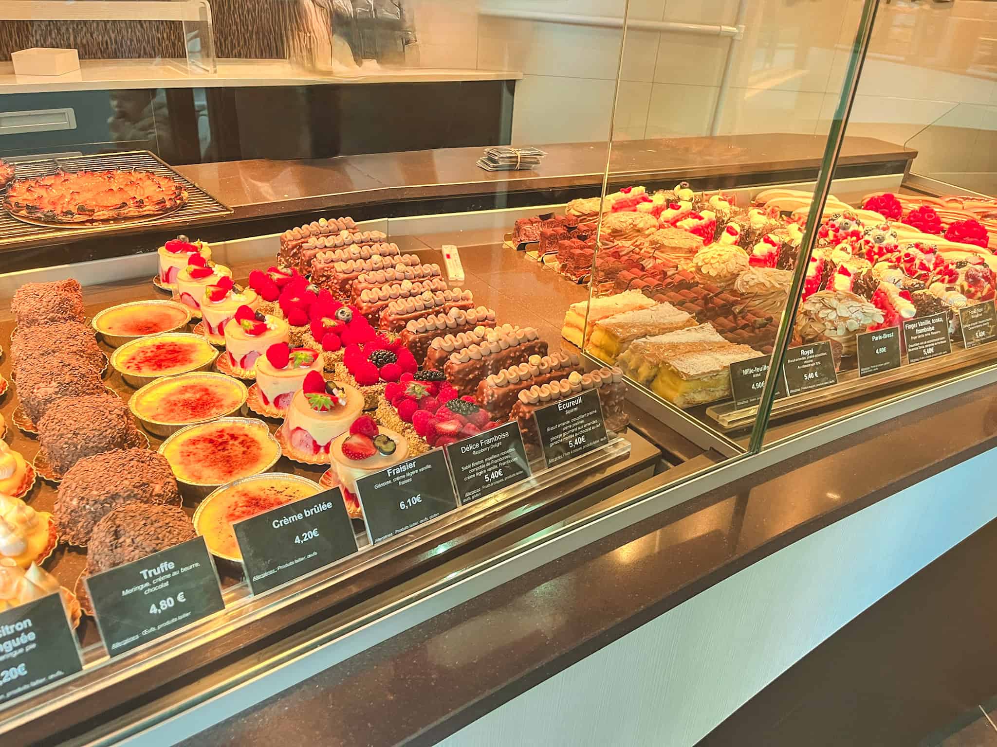 French pastry display case with crème brûlée and gourmet desserts showcasing best things to see in Paris bakery culture