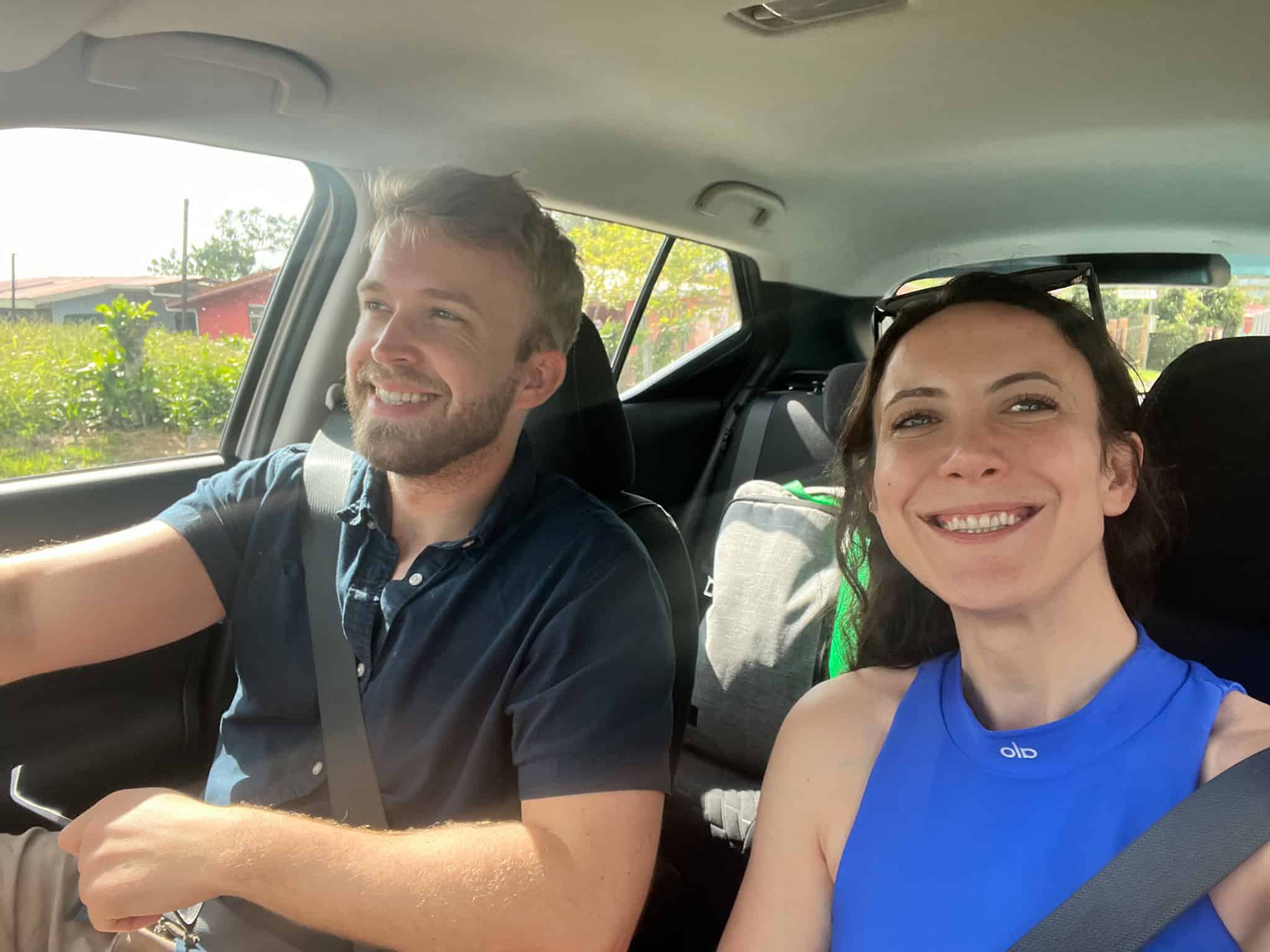 couple driving in car in costa rica