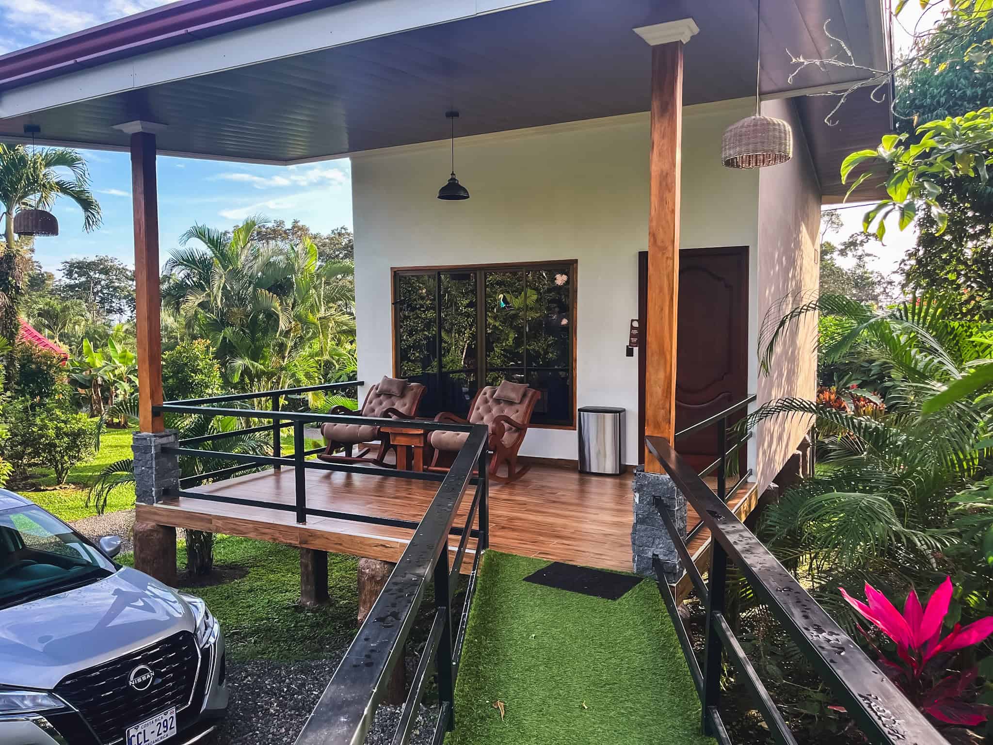 Hotel Roca Negra del Arenal elevated terrace with tropical garden setting, budget-friendly option for where to stay in La Fortuna with beautiful grounds