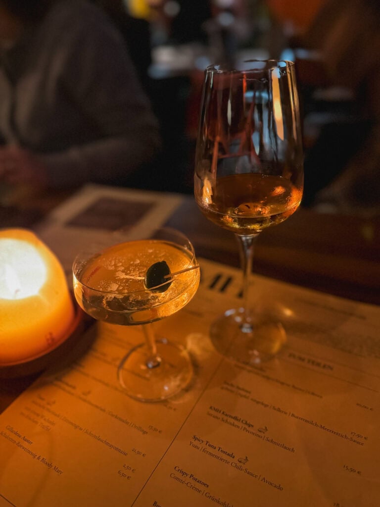 Artisan cocktails by candlelight at KMH restaurant, upscale dining experience for what to do in Frankfurt