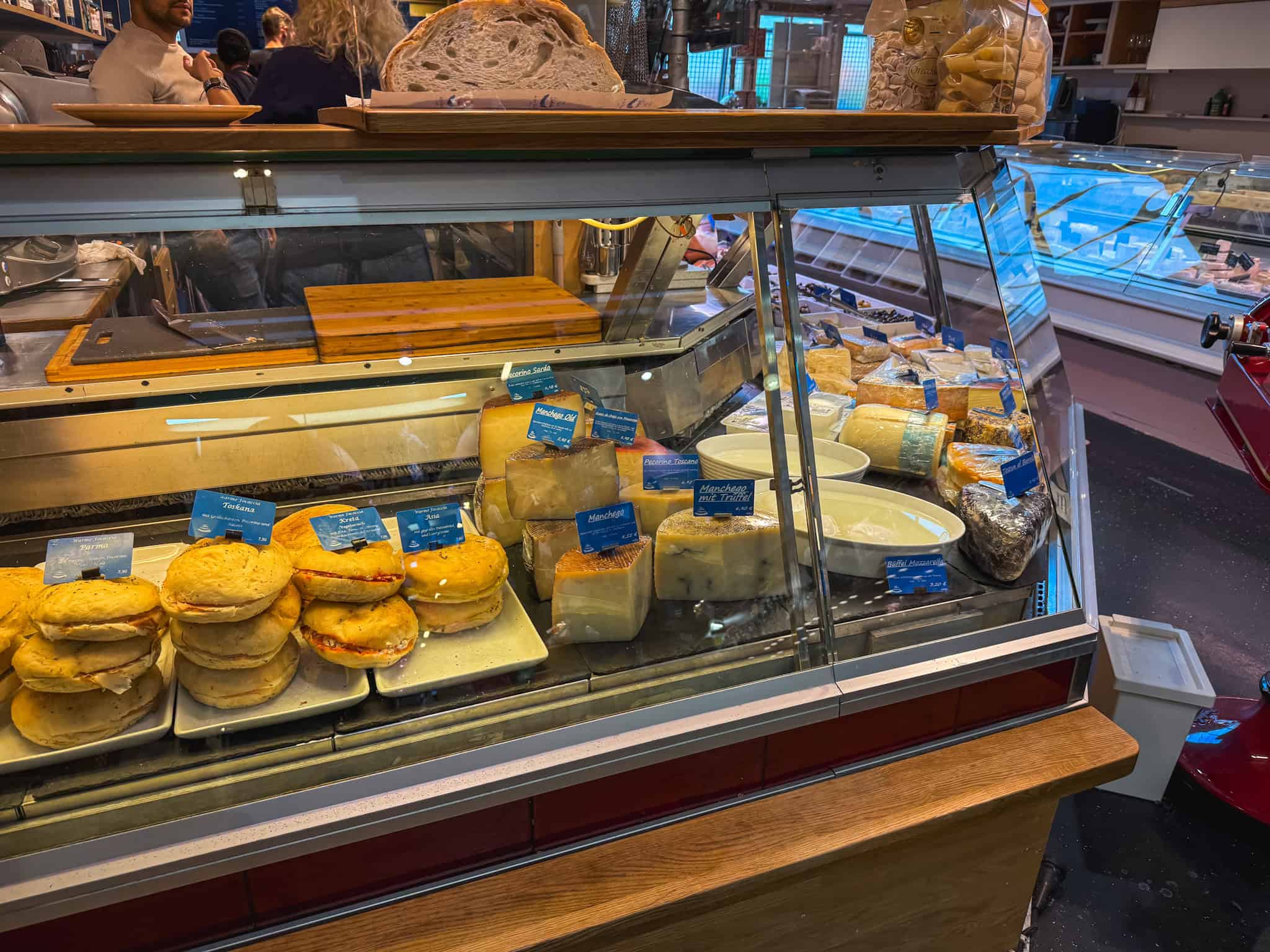Fresh artisan cheese display at Frankfurt market, perfect stop for a layover in Frankfurt