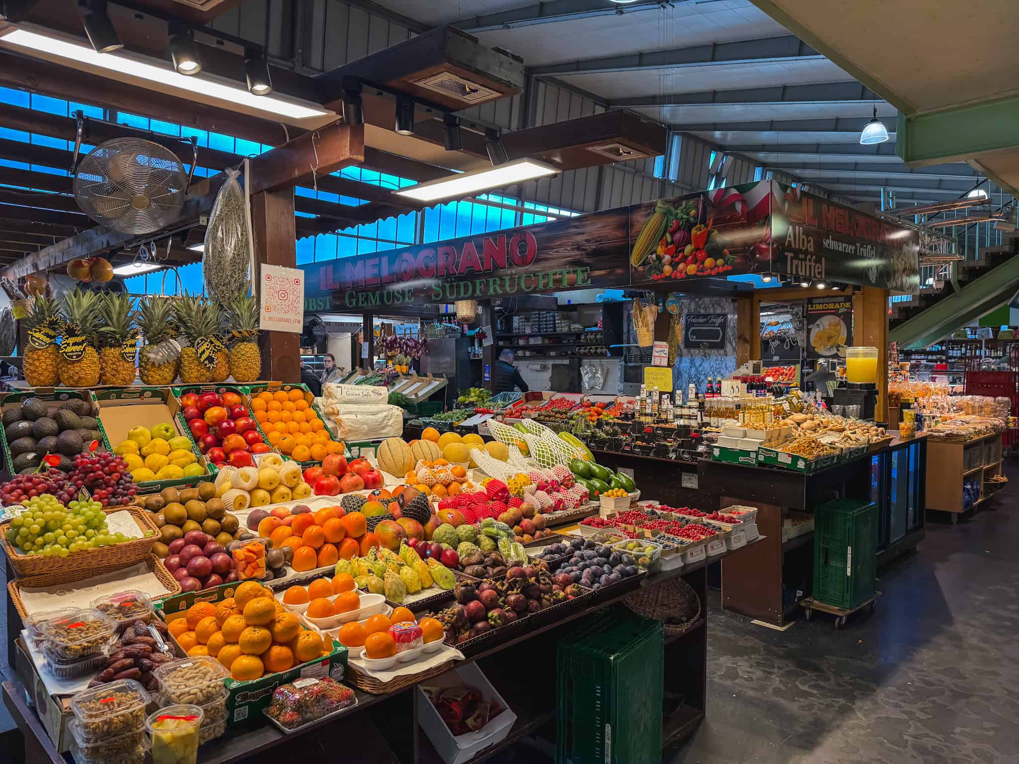 Abundant fresh fruit display at Kleinmarkthalle with tropical and local produce, culinary highlight of one day in Frankfurt