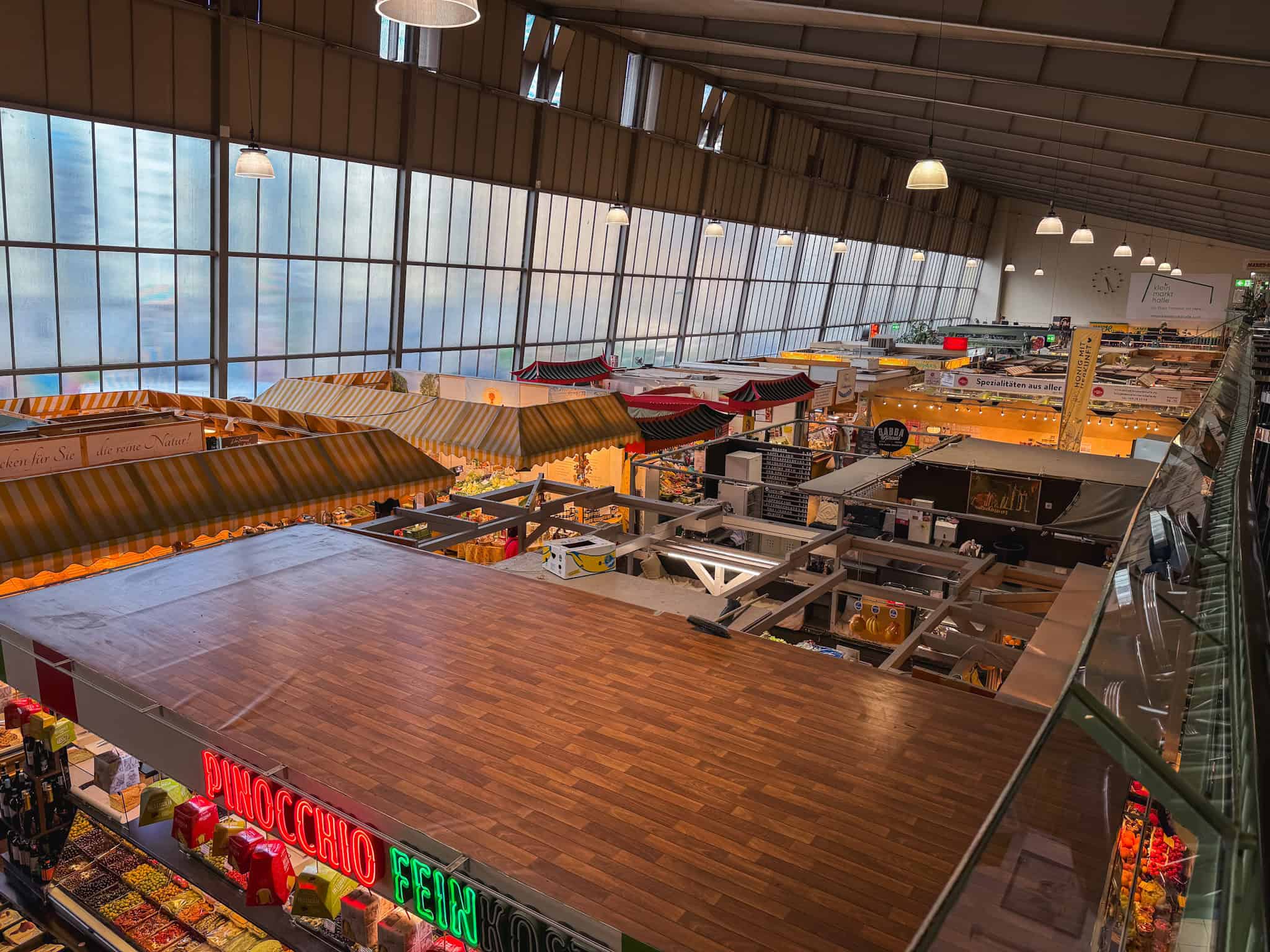 Colorful vendor stalls inside Frankfurt's historic Kleinmarkthalle, essential food market for one day in Frankfurt