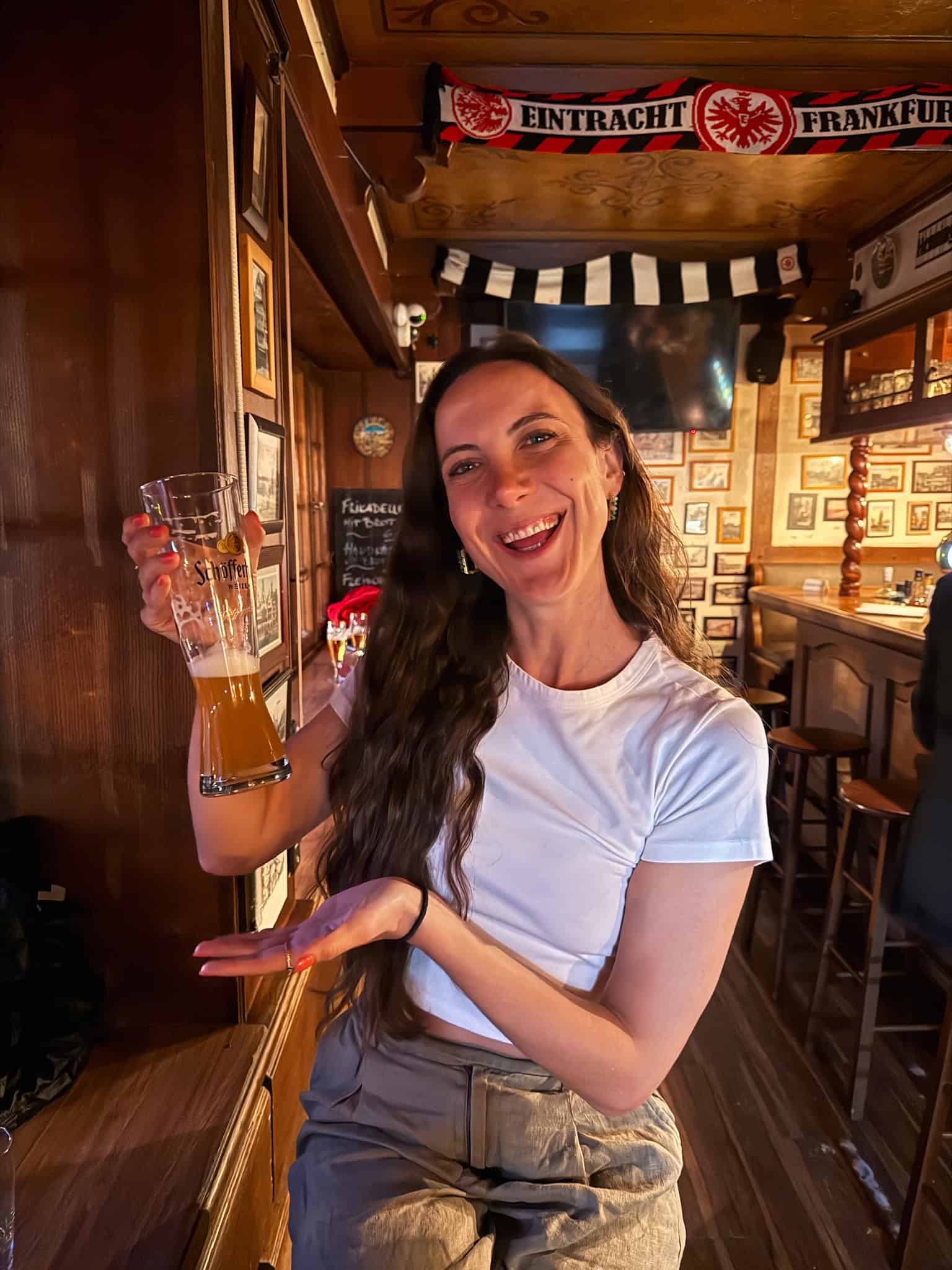 Celebrating with a traditional German wheat beer in a cozy Frankfurt pub, best things to do in Frankfurt
