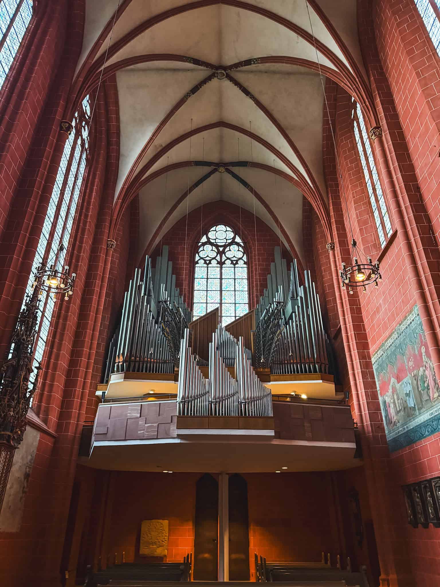 Magnificent pipe organ inside Frankfurt Cathedral with Gothic vaulted ceilings, impressive architecture to see in Frankfurt