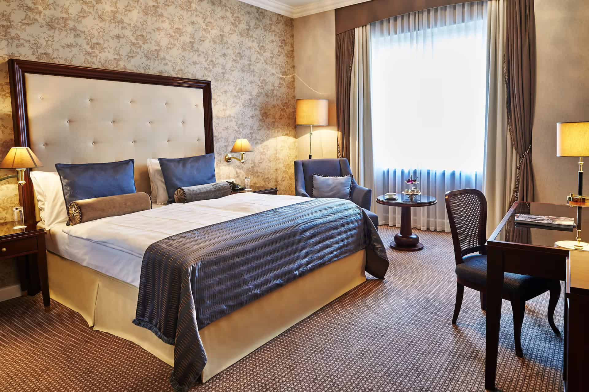 Elegant hotel room at Steigenberger Frankfurt with classic decor, ideal for a layover in Frankfurt