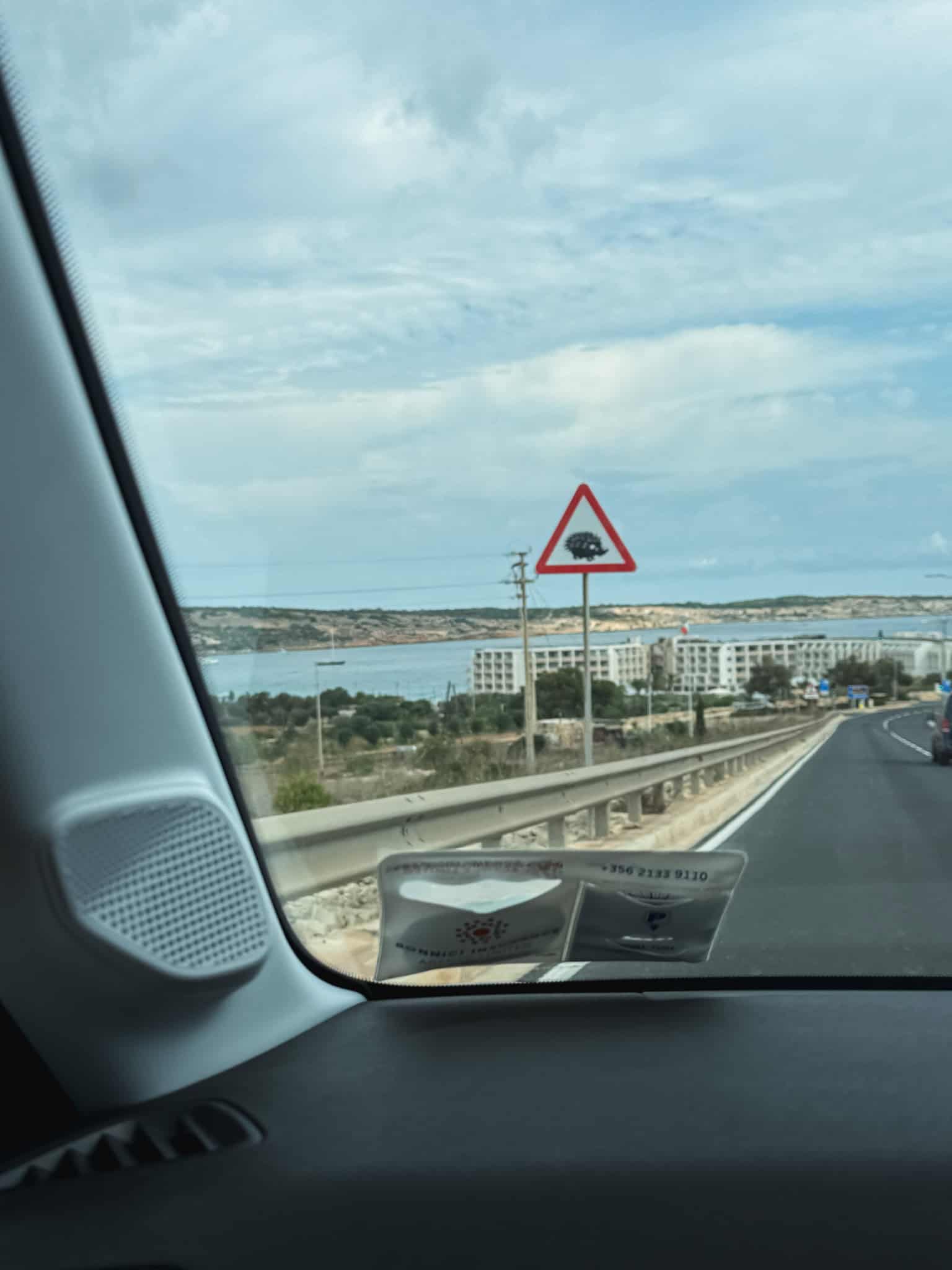 Unique hedgehog crossing warning sign while driving in Malta, reminding motorists to watch for wildlife on rural roads