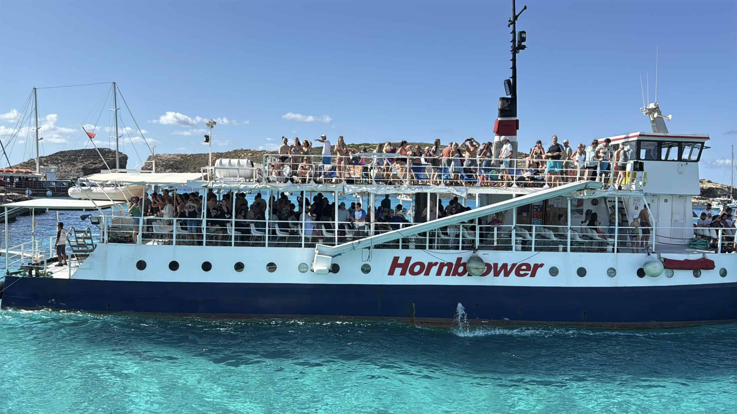 giant hornblower boat full of tourists