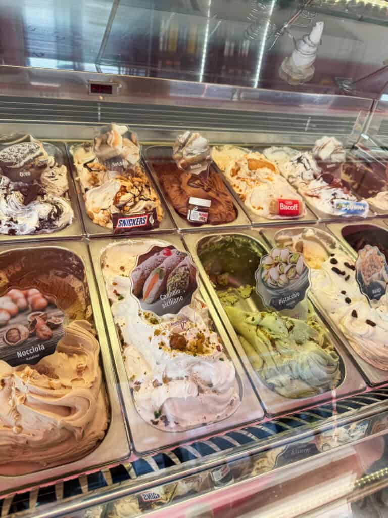 Artisan gelato display with Italian flavors including pistachio and cannoli Siciliano Malta desserts