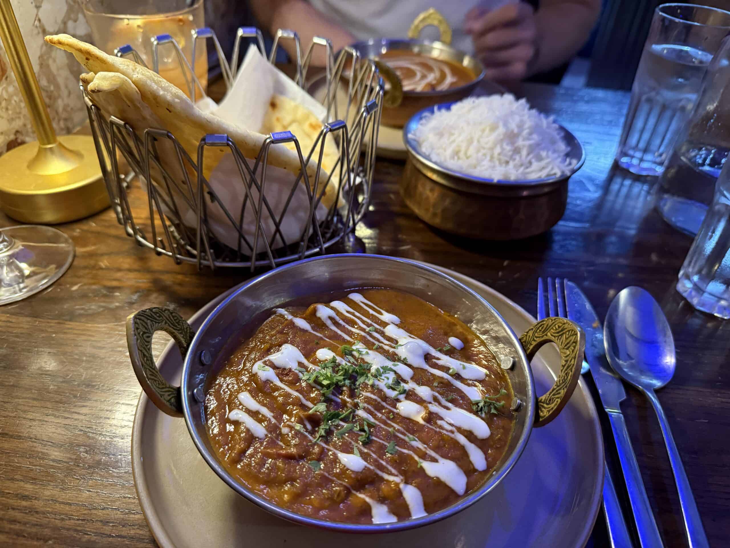 indian meal at the blue frog in malta. Curry in a bowl with naan