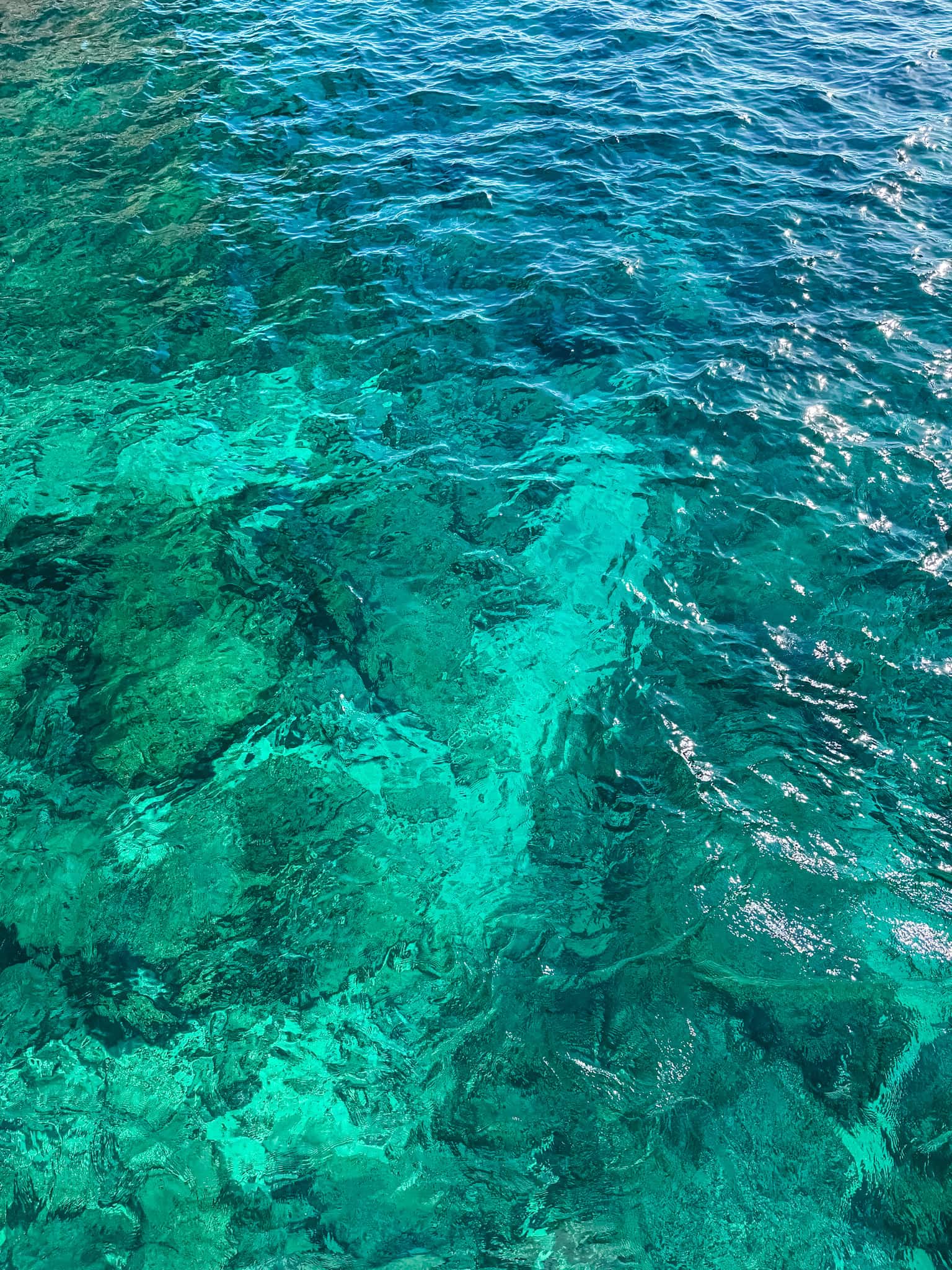 Crystal clear turquoise Mediterranean waters perfect for swimming and snorkeling on one week in Malta trip