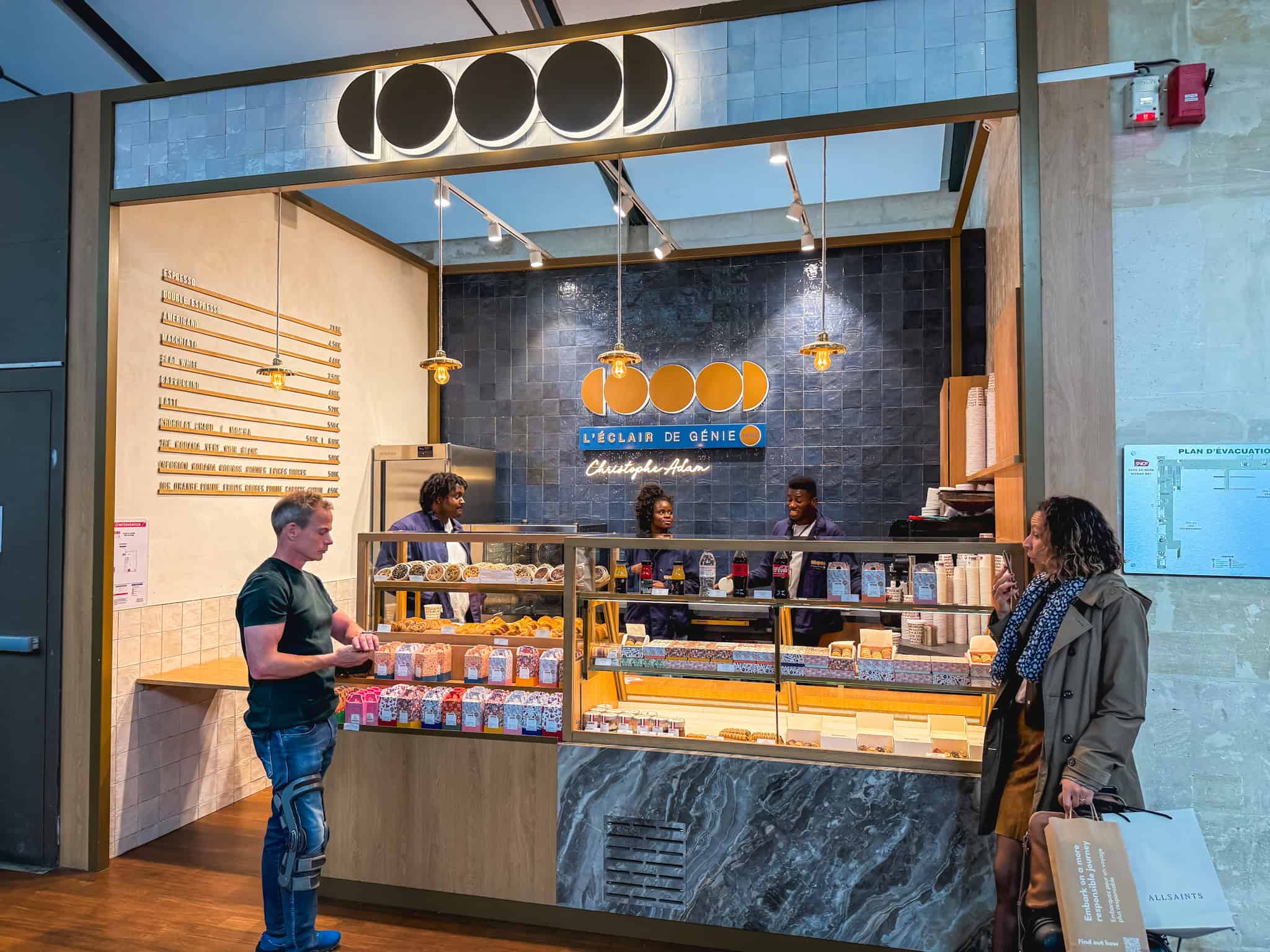 L'Éclair de Génie pastry boutique at Gare du Nord offering French éclairs, pastries, and espresso to Eurostar passengers before departure
