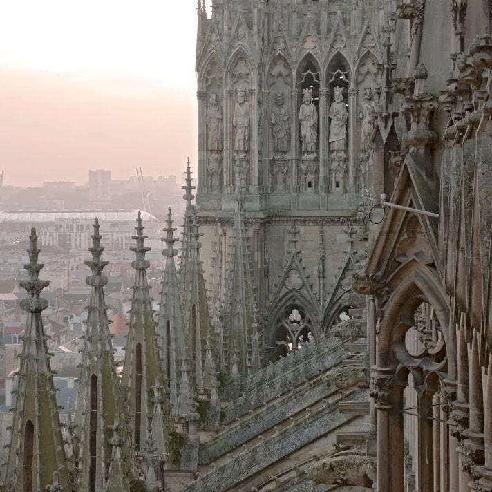 Gothic architecture details of Reims Cathedral when you visit Champagne from Paris by train