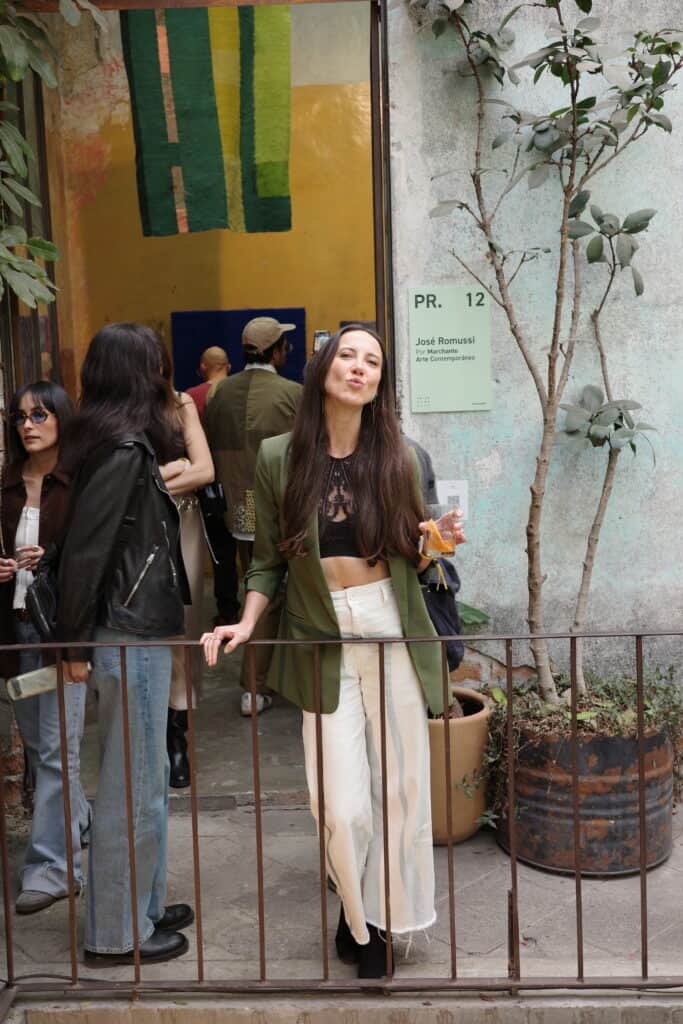 Woman outside gallery entrance at art week Mexico City gallery opening event Salon Acme