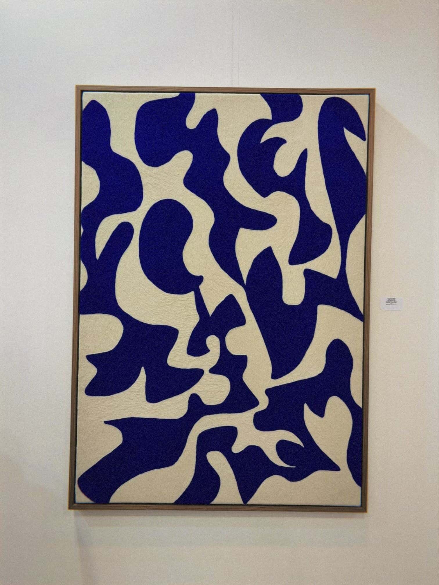 Blue and cream abstract cut-out artwork displayed at Mexico City art scene gallery