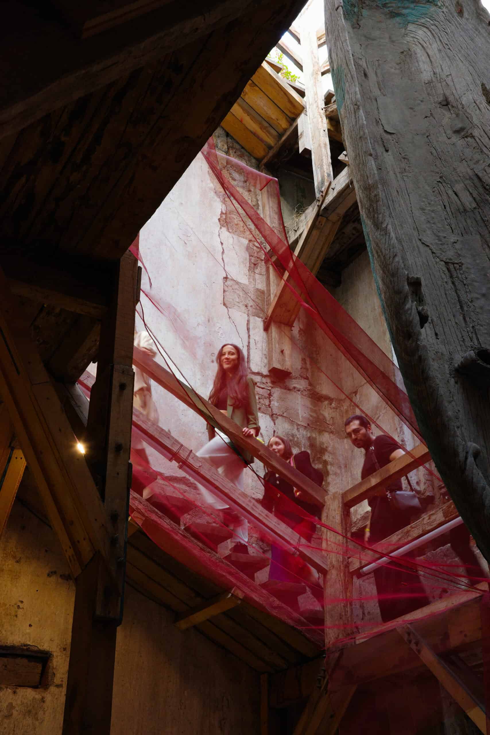 girl walking up stairs with red overhang