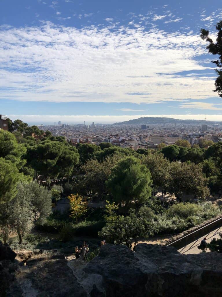 Panoramic view of Barcelona city skyline and Mediterranean coast from Park Güell hillside — European summer vacations Barcelona sightseeing