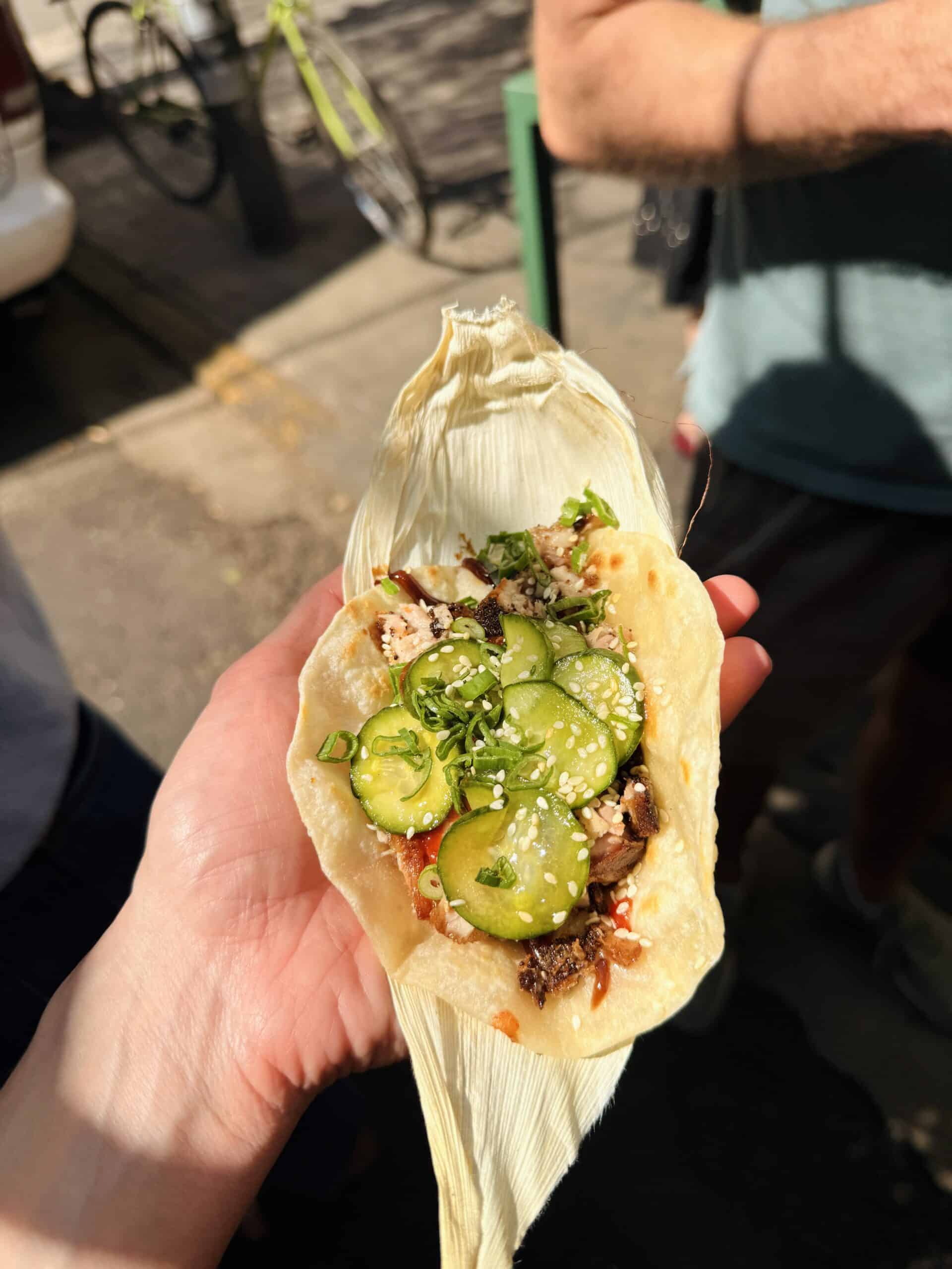 cantonese taco with cucumber on it