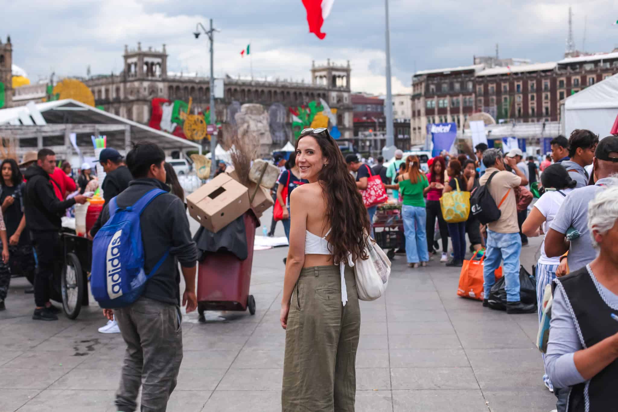 woman in green pants and white top in centro historico in mexico city