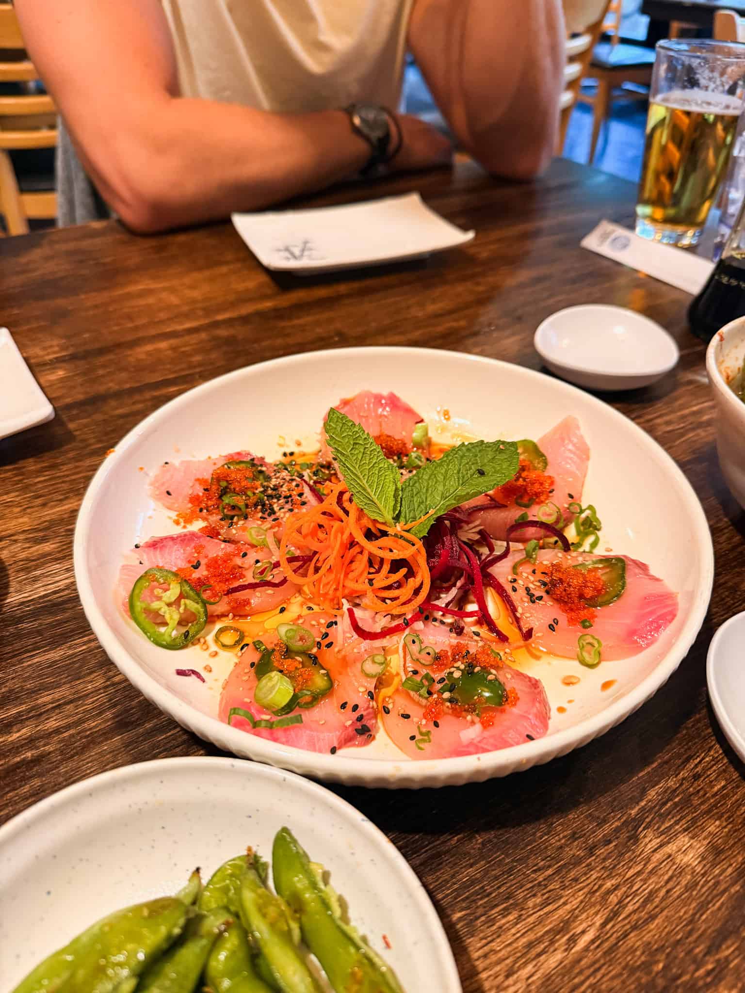 Yellowtail crudo with jalapeño, roe, shredded carrot, mint, and sesame at one of the best South Lake Tahoe restaurants